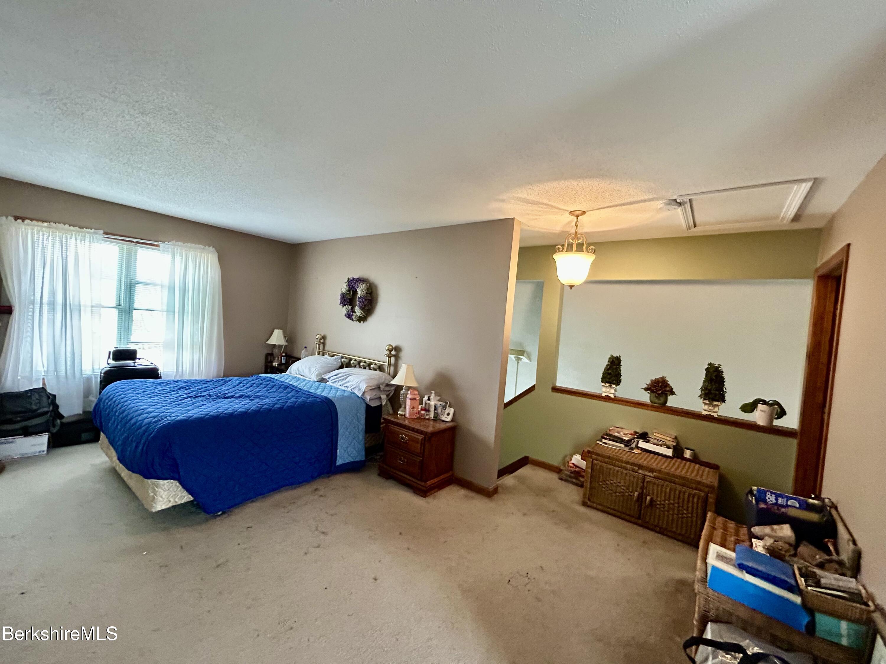 20 Richmond Way Chicopee, MA 01022 - Photo 14 of 25 a bedroom with furniture and a window