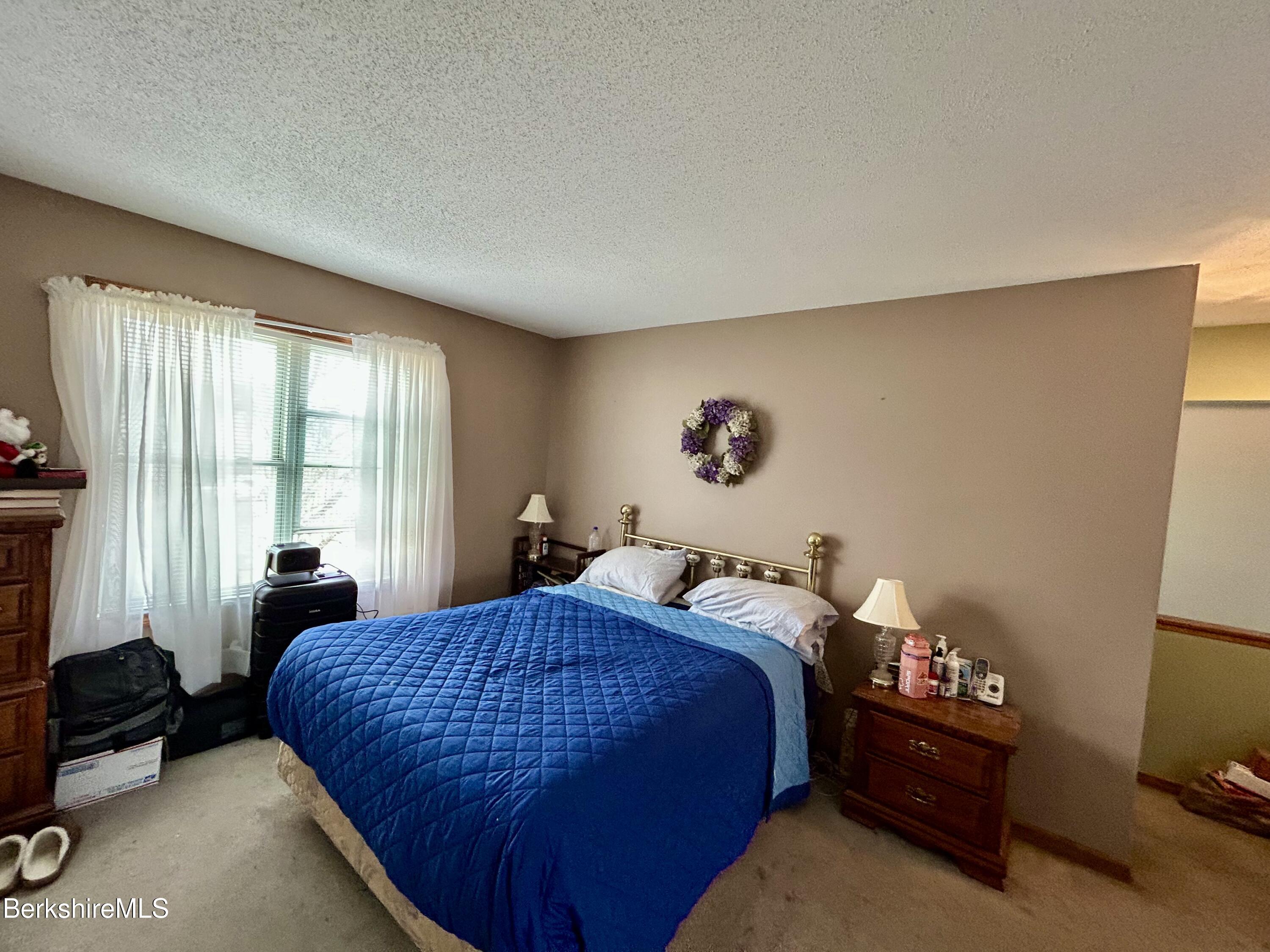 20 Richmond Way Chicopee, MA 01022 - Photo 15 of 25 a bed room with two bed and a large window