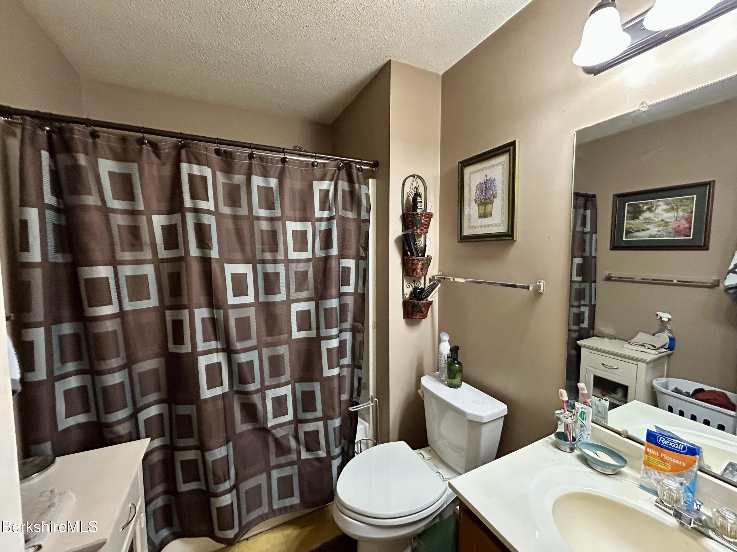 20 Richmond Way Chicopee, MA 01022 - Photo 16 of 25 a bathroom with a sink toilet and shower