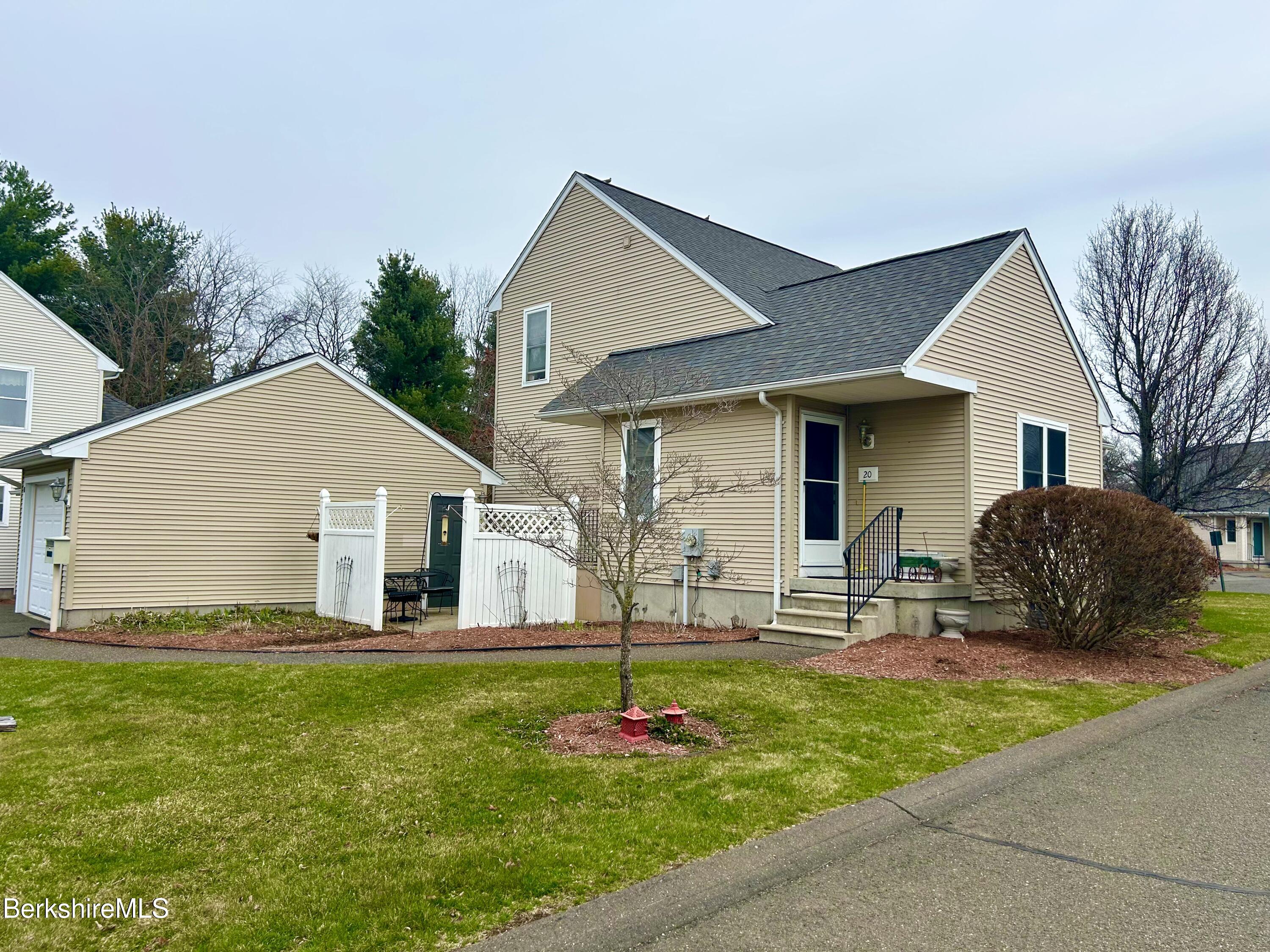 20 Richmond Way Chicopee, MA 01022 - Photo 20 of 25 a front view of house with yard and green space