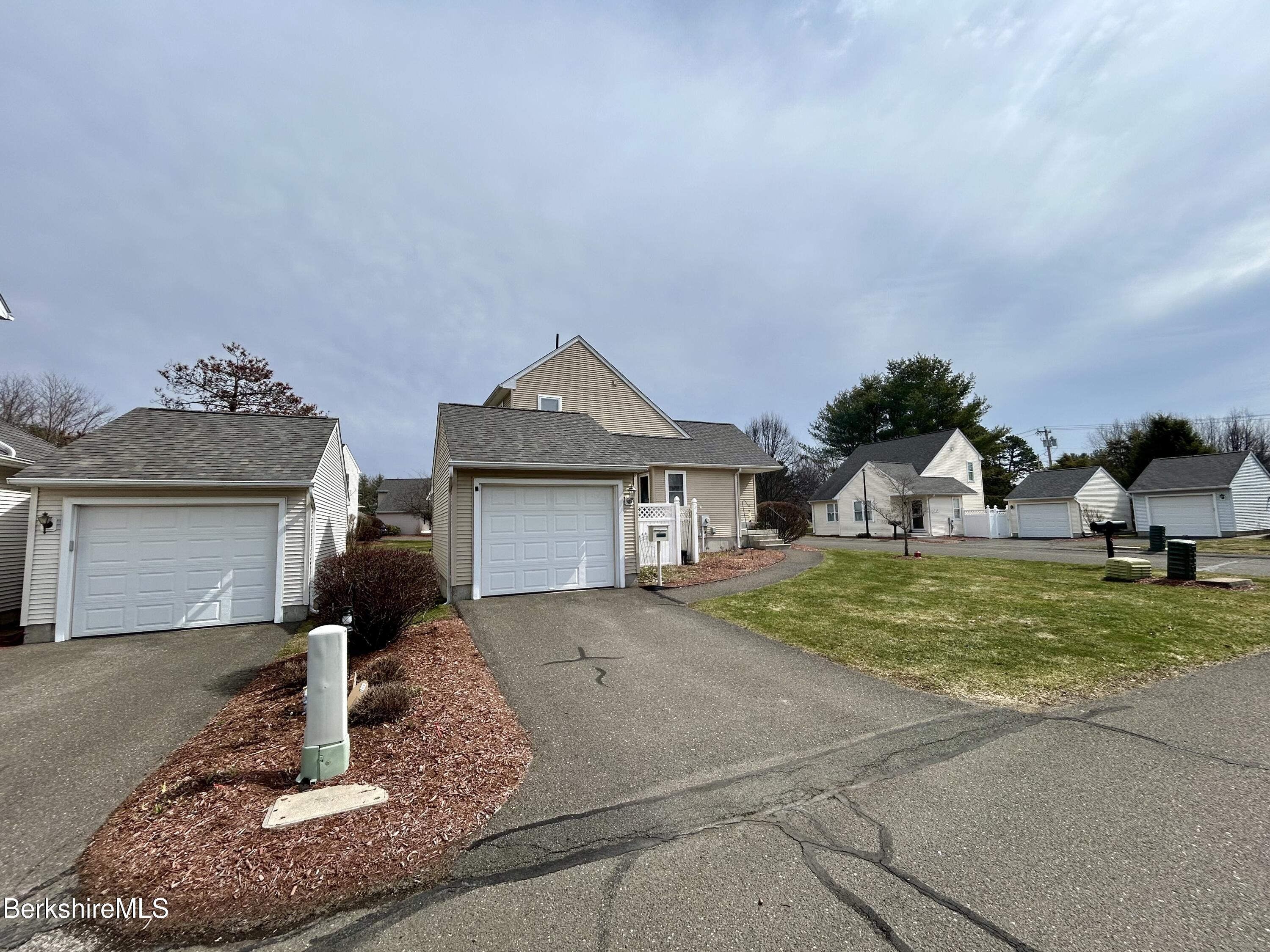 20 Richmond Way Chicopee, MA 01022 - Photo 2 of 25 a front view of a house with garden