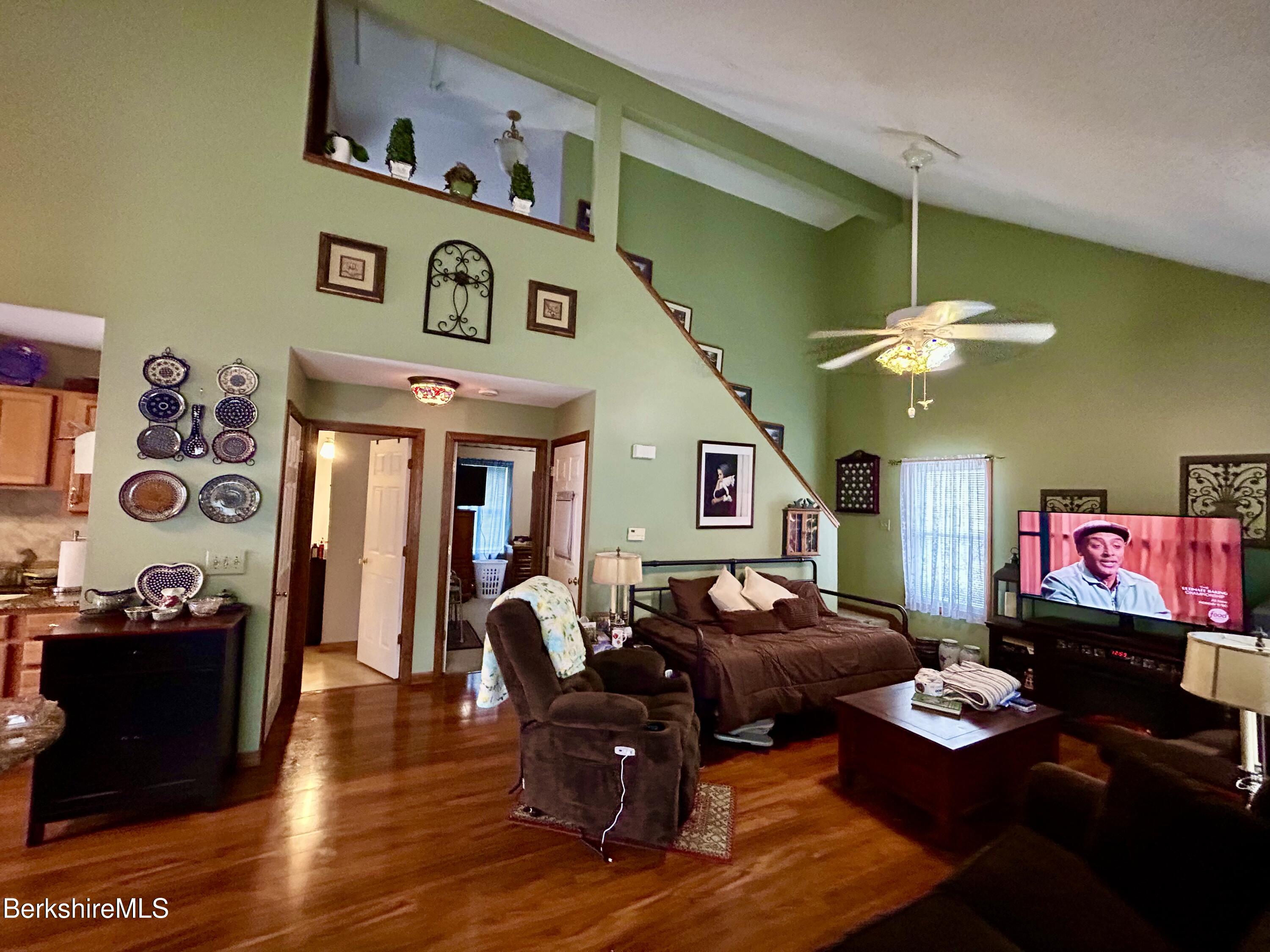 20 Richmond Way Chicopee, MA 01022 - Photo 3 of 25 a living room with furniture and a flat screen tv