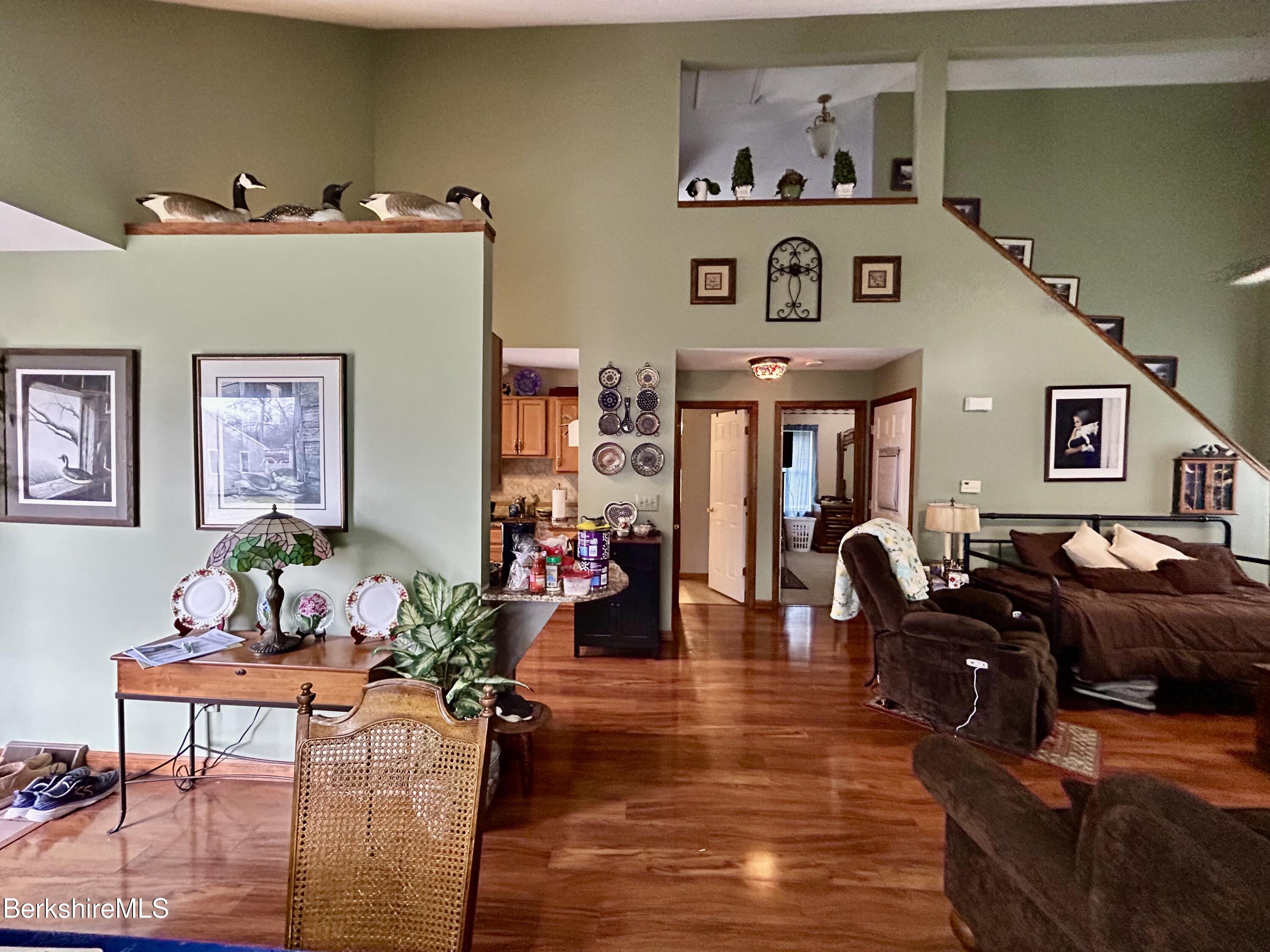 20 Richmond Way Chicopee, MA 01022 - Photo 4 of 25 a living room with furniture piano and a chandelier