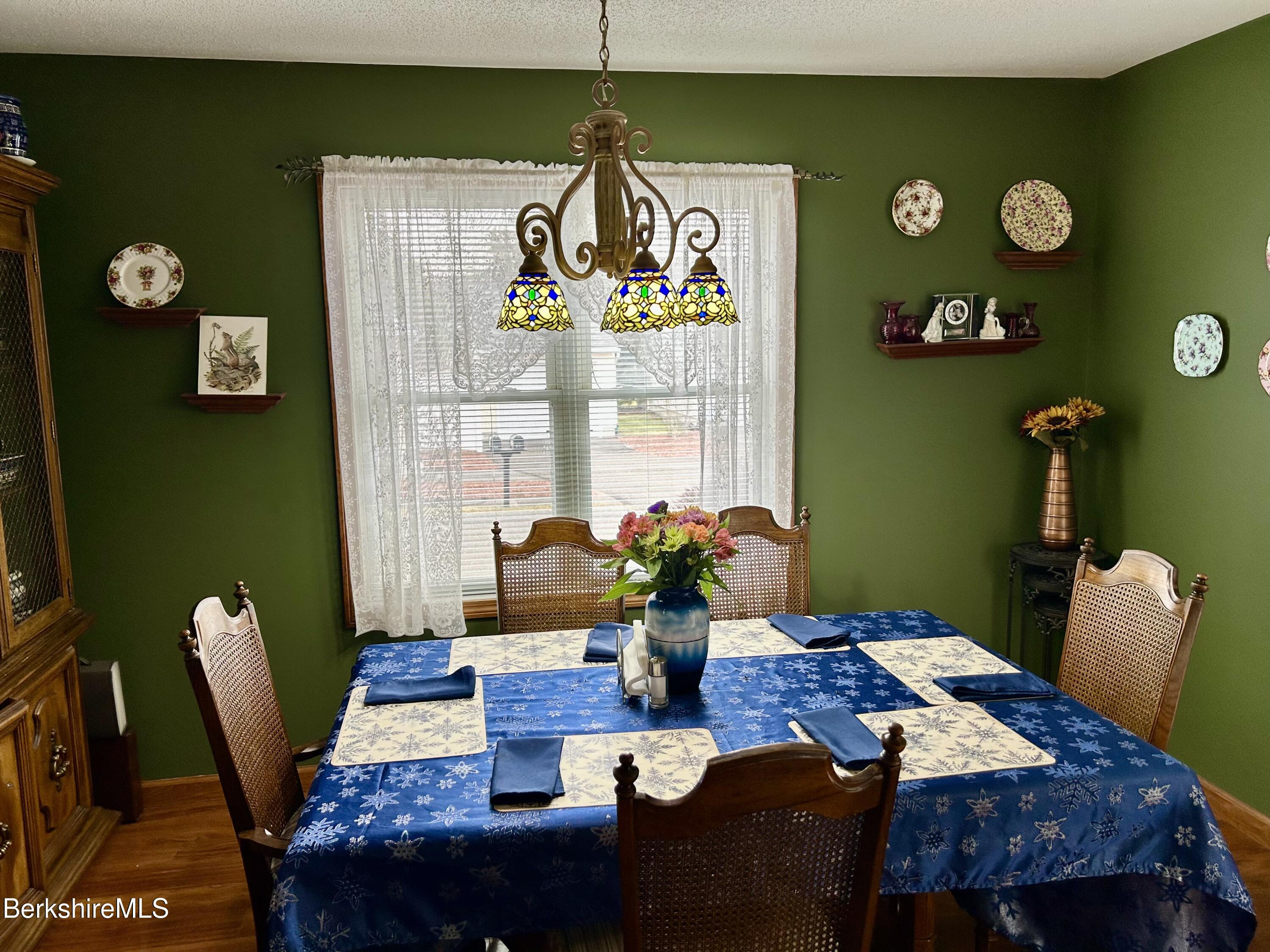20 Richmond Way Chicopee, MA 01022 - Photo 5 of 25 a view of a dining room with furniture one side of a kitchen and a window