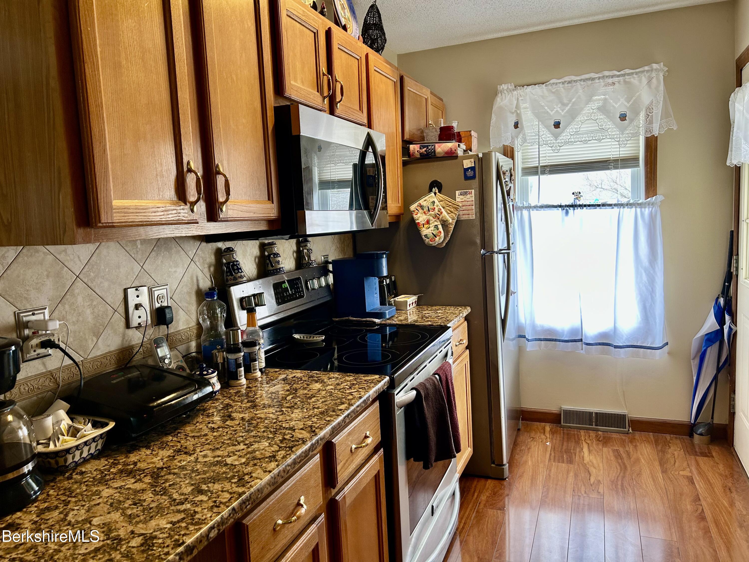 20 Richmond Way Chicopee, MA 01022 - Photo 7 of 25 a kitchen with stove and a window