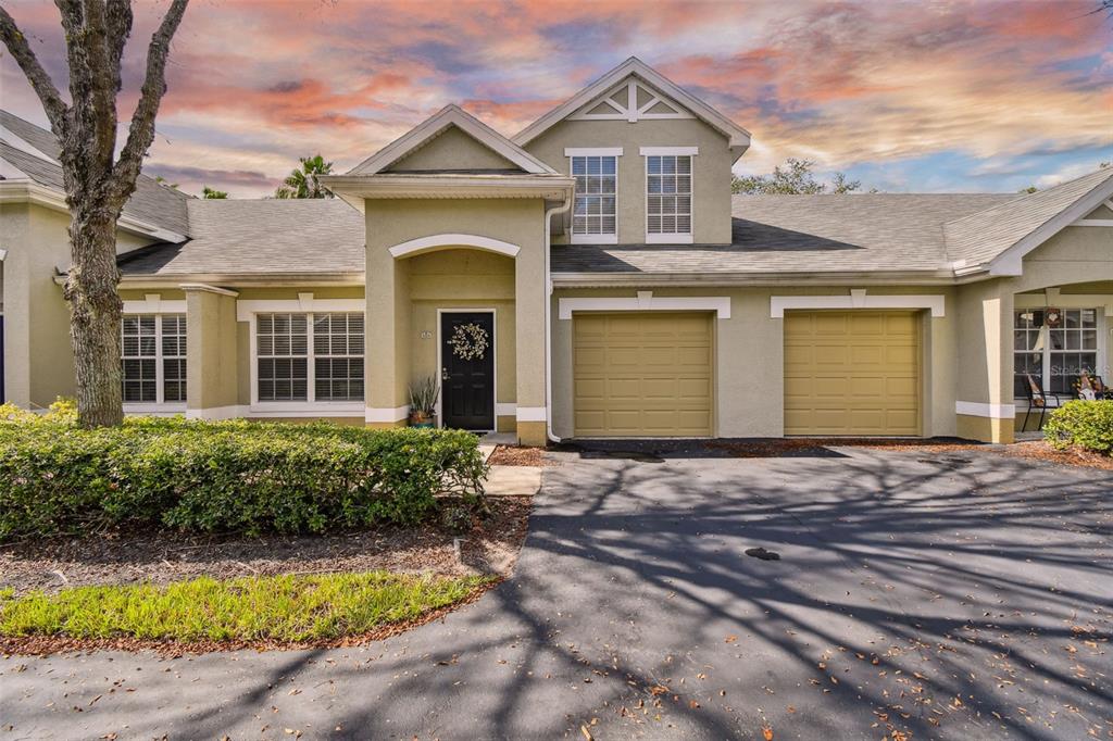 3526 Kings Road, Unit 105 Palm Harbor, FL 34685 - Photo 1 of 1 a front view of a house with yard