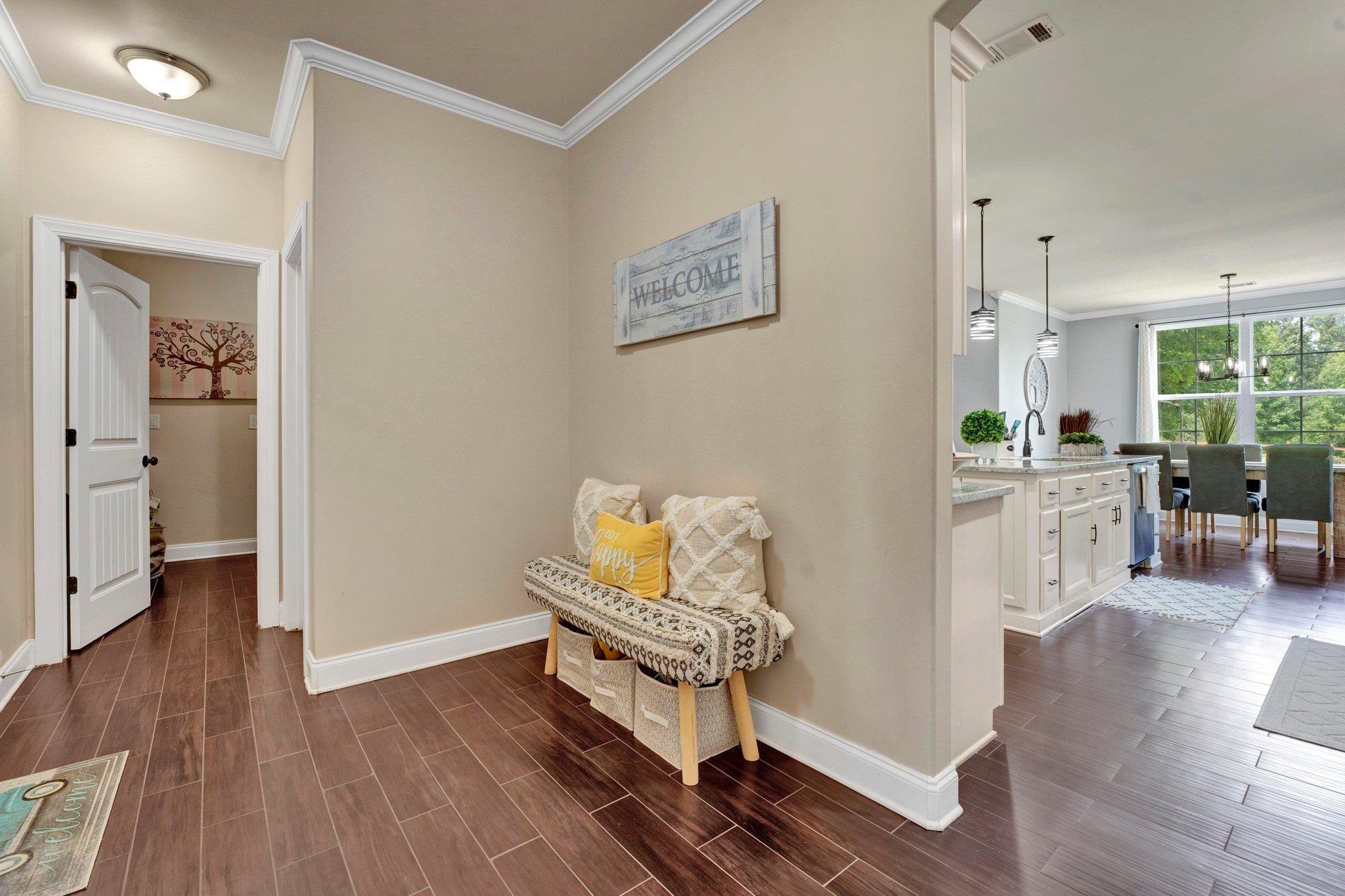 3270 Rast Road Millington, TN 38053 - Photo 19 of 40 Corridor with crown molding and wood tiled floors