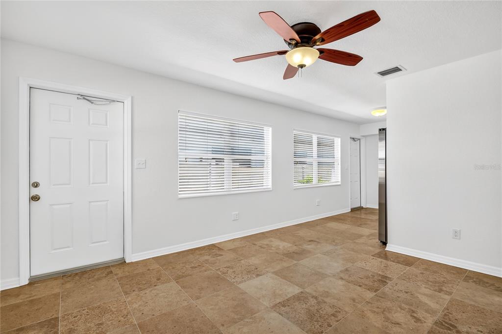 13440 1st Street East Madeira Beach, FL 33708 - Photo 18 of 44 a view of an empty room with a window