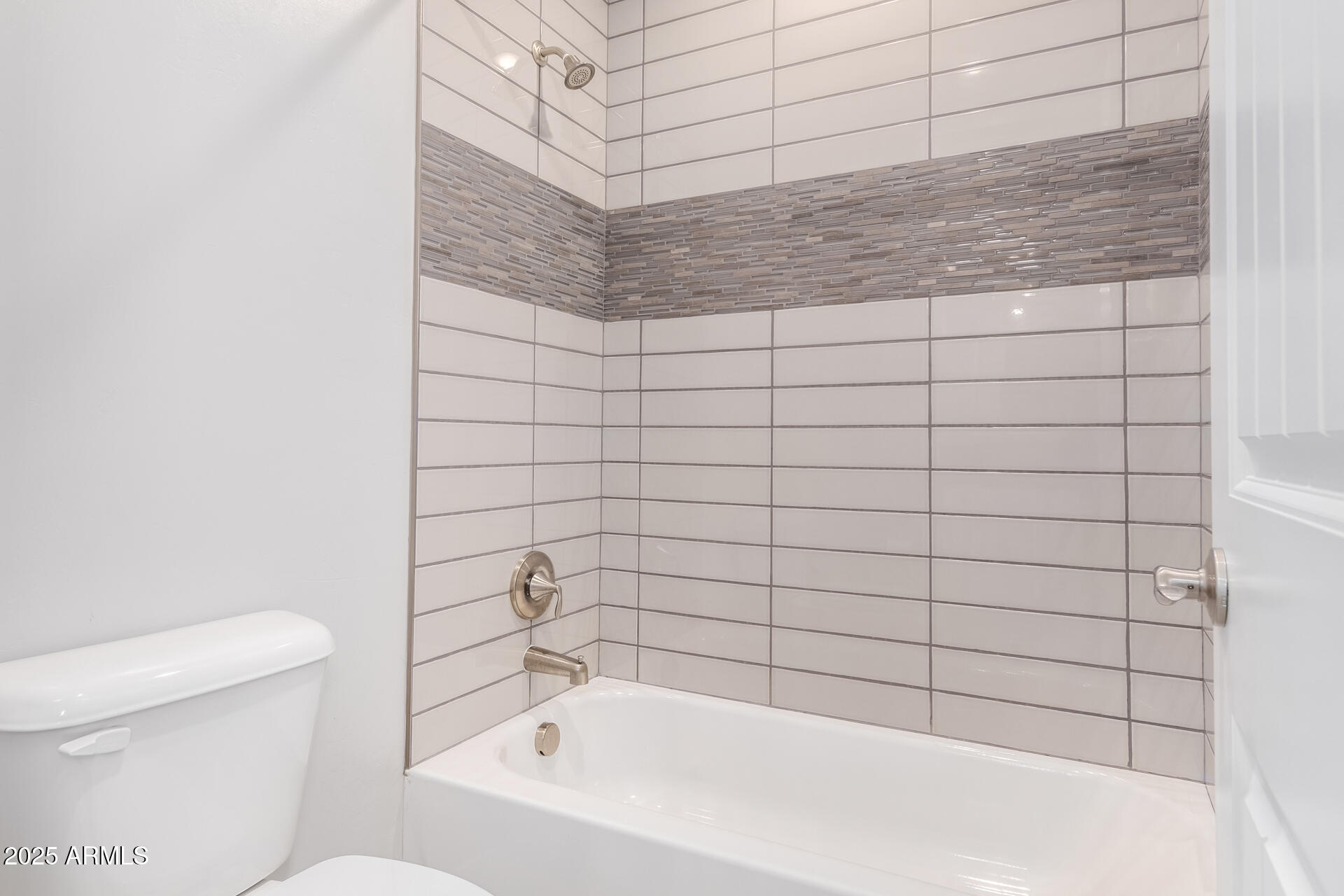 1848 South Follett Way Gilbert, AZ 85295 - Photo 21 of 32 a bathroom with a bathtub and toilet