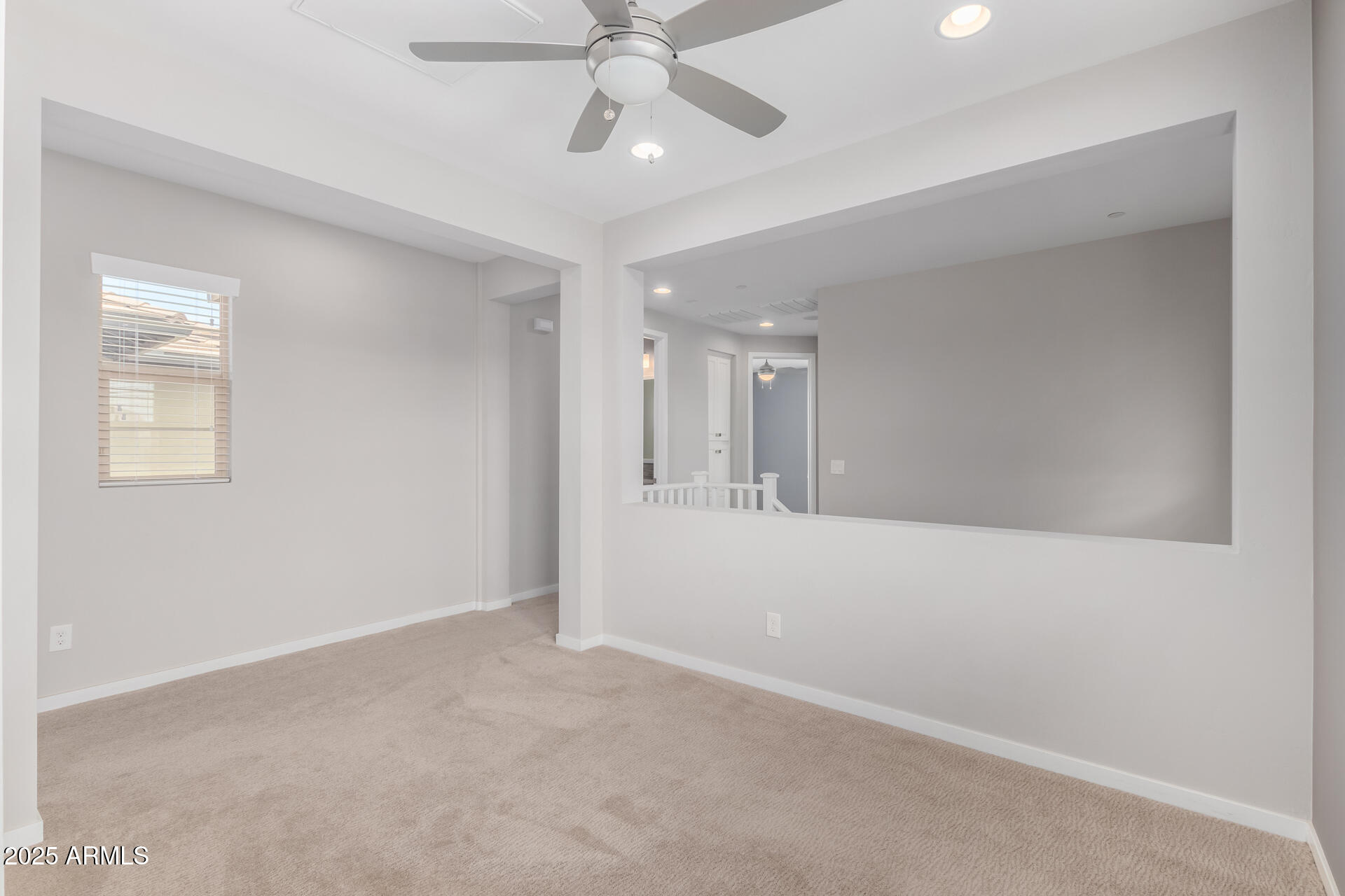 1848 South Follett Way Gilbert, AZ 85295 - Photo 23 of 32 an empty room with chandelier fan and windows