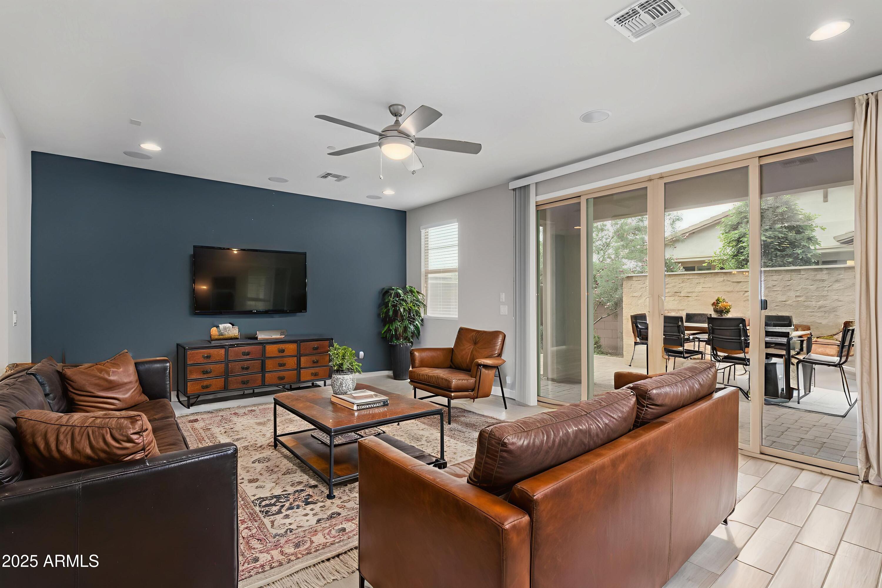 1848 South Follett Way Gilbert, AZ 85295 - Photo 3 of 32 a living room with furniture and a flat screen tv