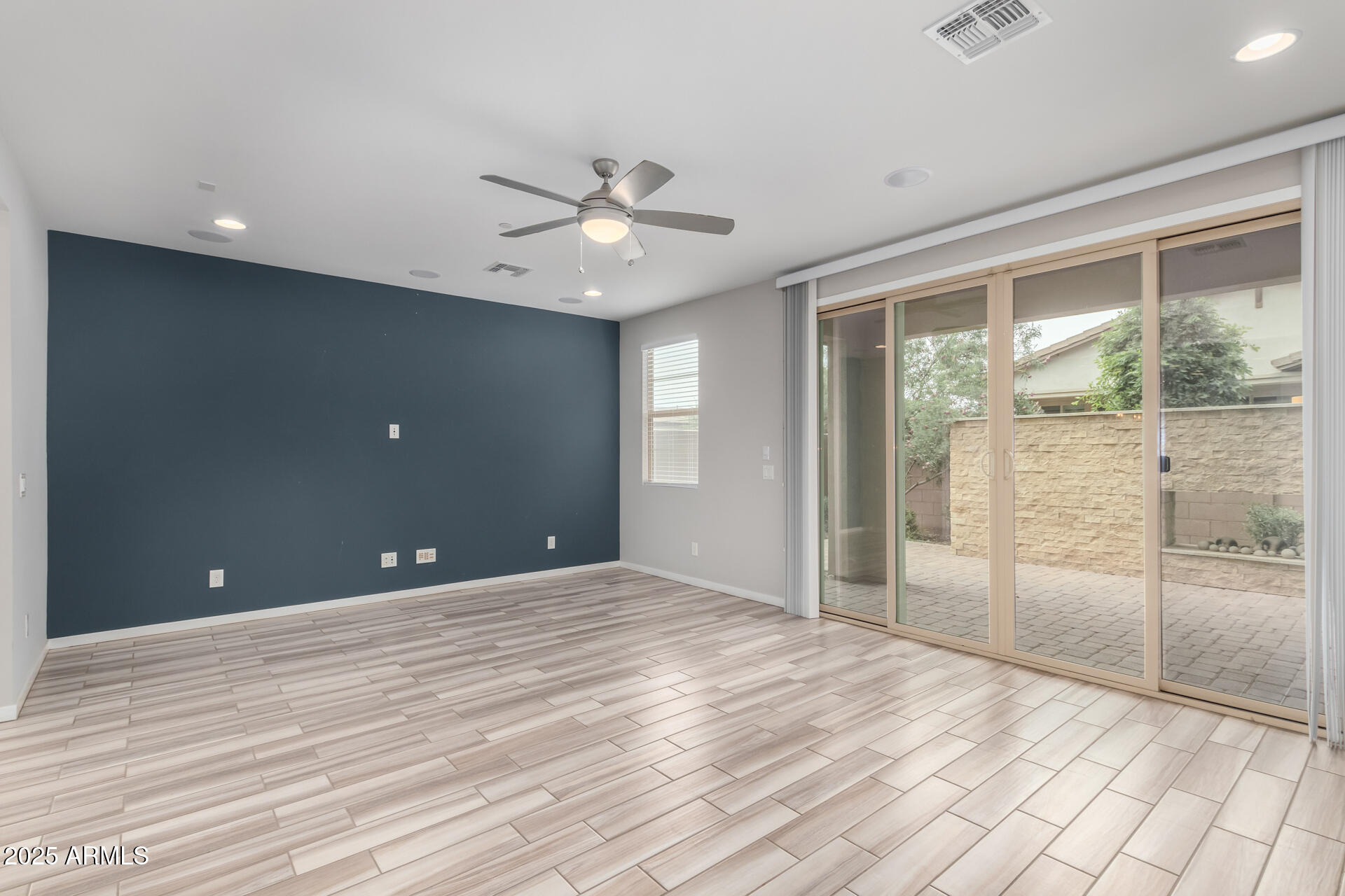 1848 South Follett Way Gilbert, AZ 85295 - Photo 4 of 32 a view of a livingroom with a chandelier fan and windows
