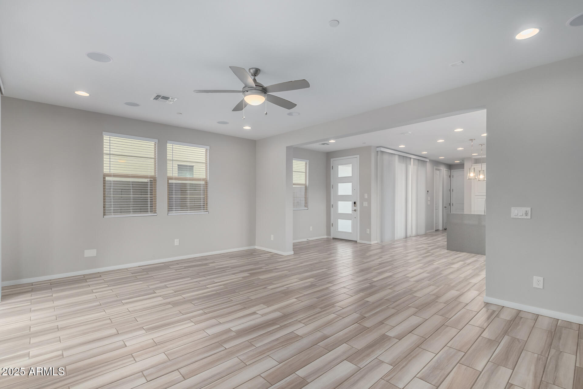1848 South Follett Way Gilbert, AZ 85295 - Photo 6 of 32 a view of an empty room with wooden floor and a window