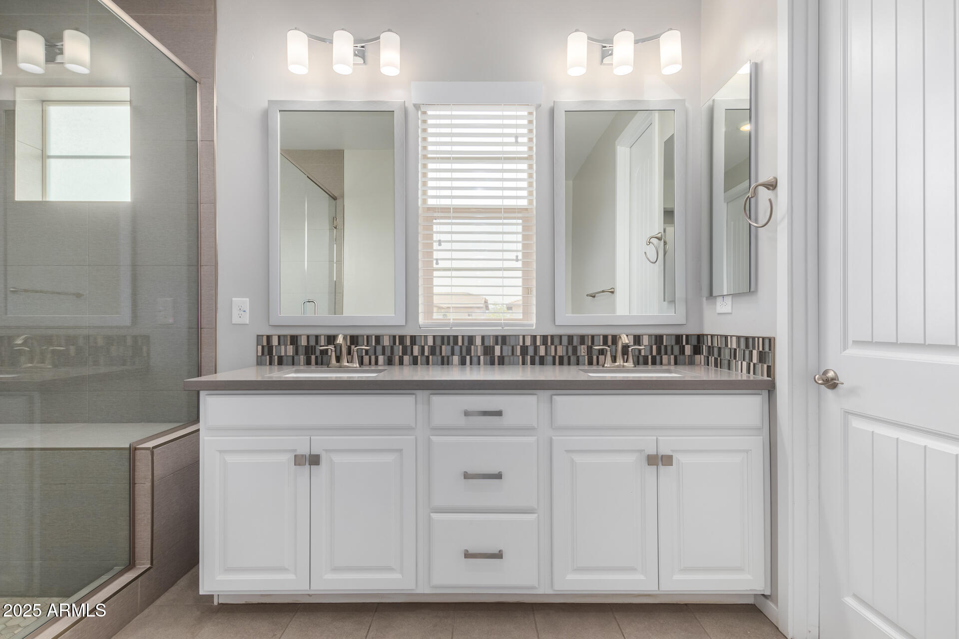 1848 South Follett Way Gilbert, AZ 85295 - Photo 7 of 32 a bathroom with a sink and a mirror