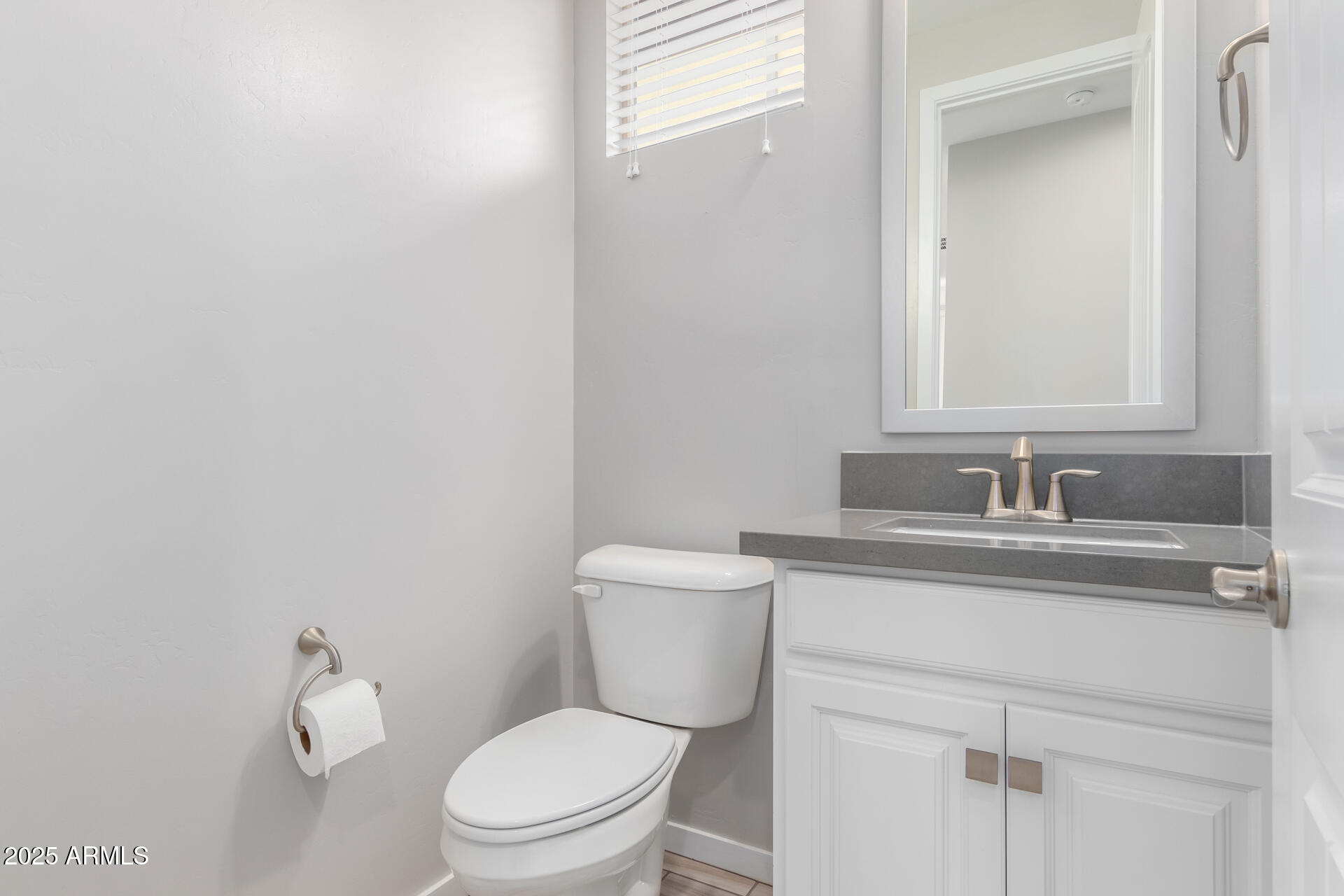 1848 South Follett Way Gilbert, AZ 85295 - Photo 10 of 32 a bathroom with a toilet sink vanity granite and mirror