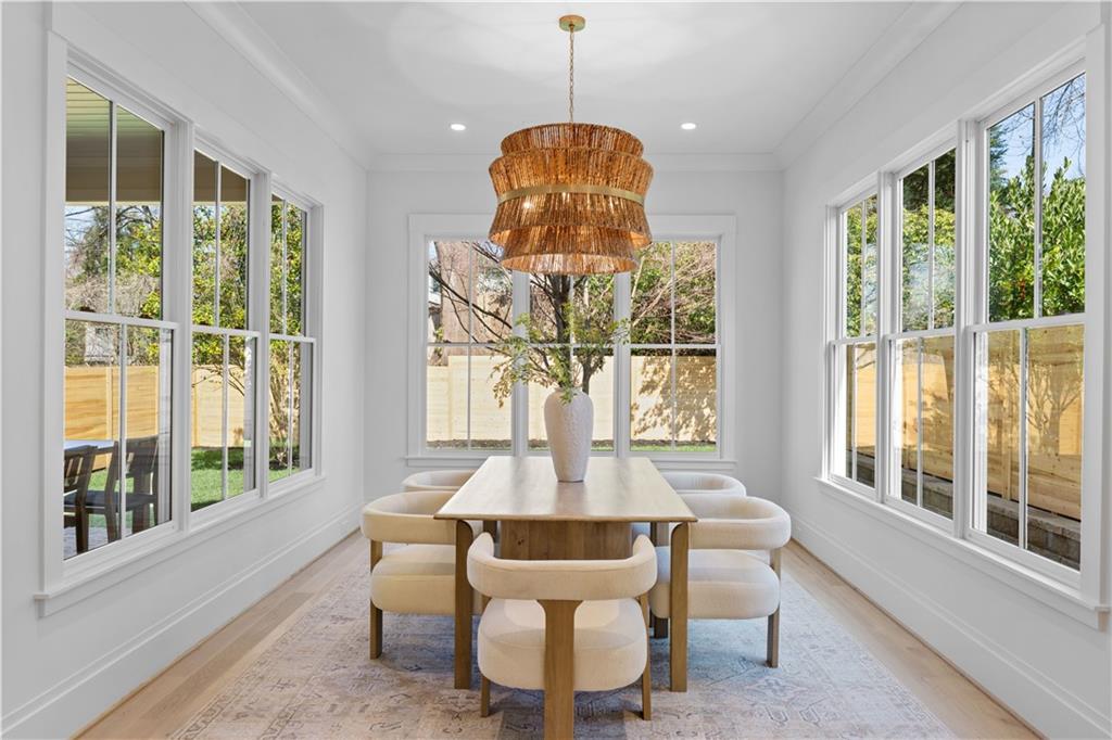 1140 Rosedale Drive Northeast Atlanta, GA 30306 - Photo 20 of 50 a dining room with furniture a chandelier and wooden floor
