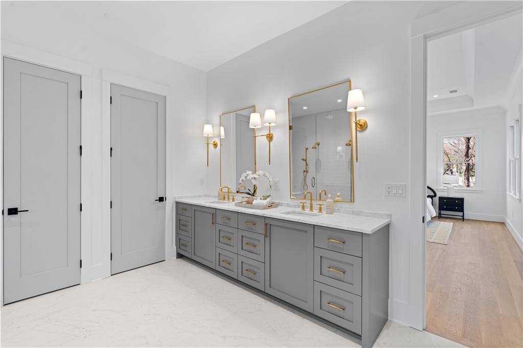 1140 Rosedale Drive Northeast Atlanta, GA 30306 - Photo 35 of 50 a spacious bathroom with a double vanity sink and a mirror