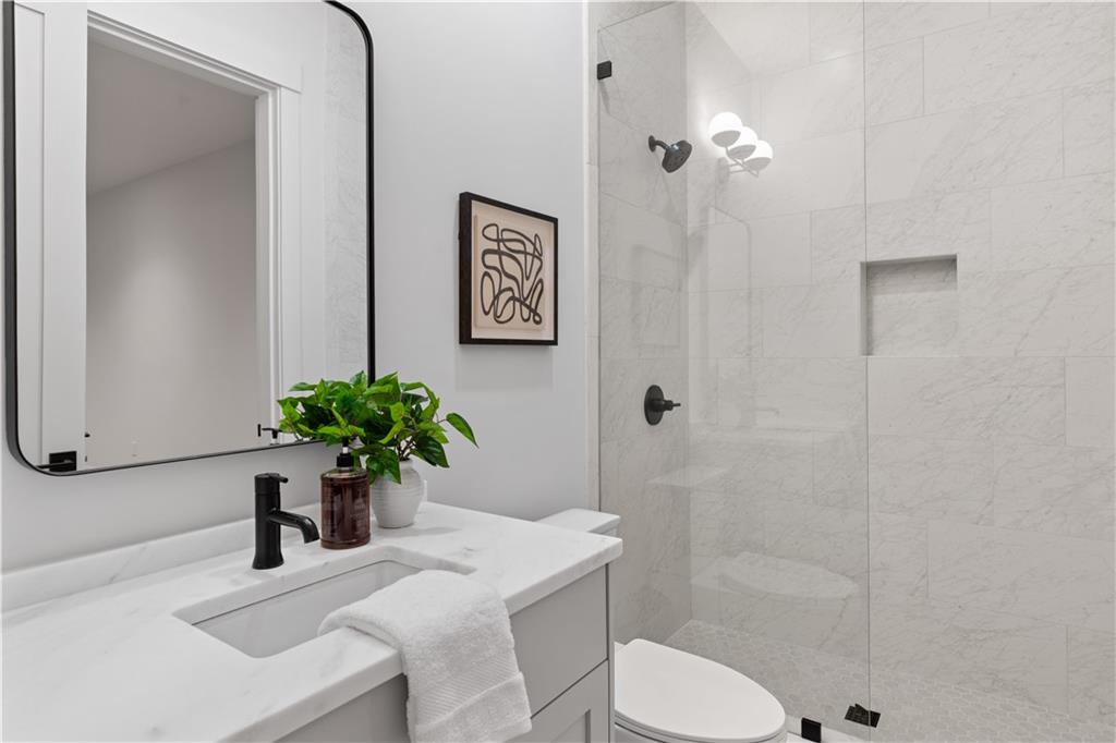 1140 Rosedale Drive Northeast Atlanta, GA 30306 - Photo 45 of 50 a bathroom with a sink toilet and shower