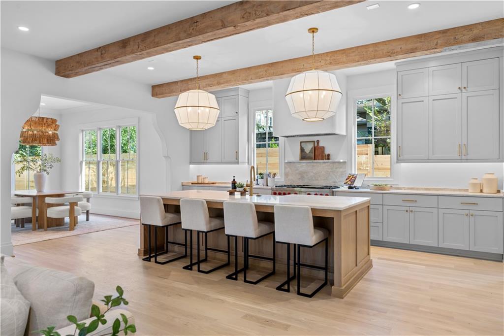 1140 Rosedale Drive Northeast Atlanta, GA 30306 - Photo 5 of 50 a view of a kitchen with a dining table chairs and chandelier