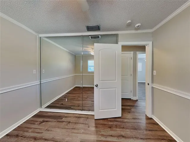 a view of entryway with wooden floor