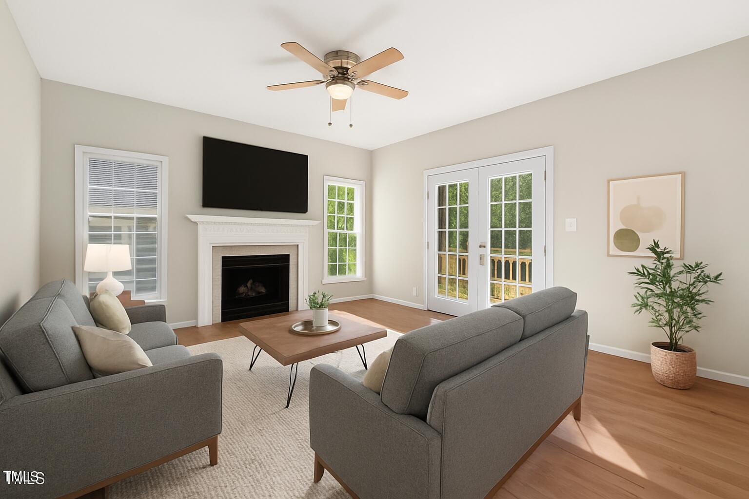 1909 Redding Lane Durham, NC 27712 - Photo 17 of 49 a living room with furniture fireplace and a flat screen tv