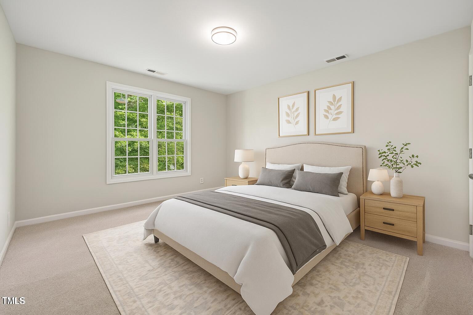 1909 Redding Lane Durham, NC 27712 - Photo 25 of 49 a bedroom with bed and a window