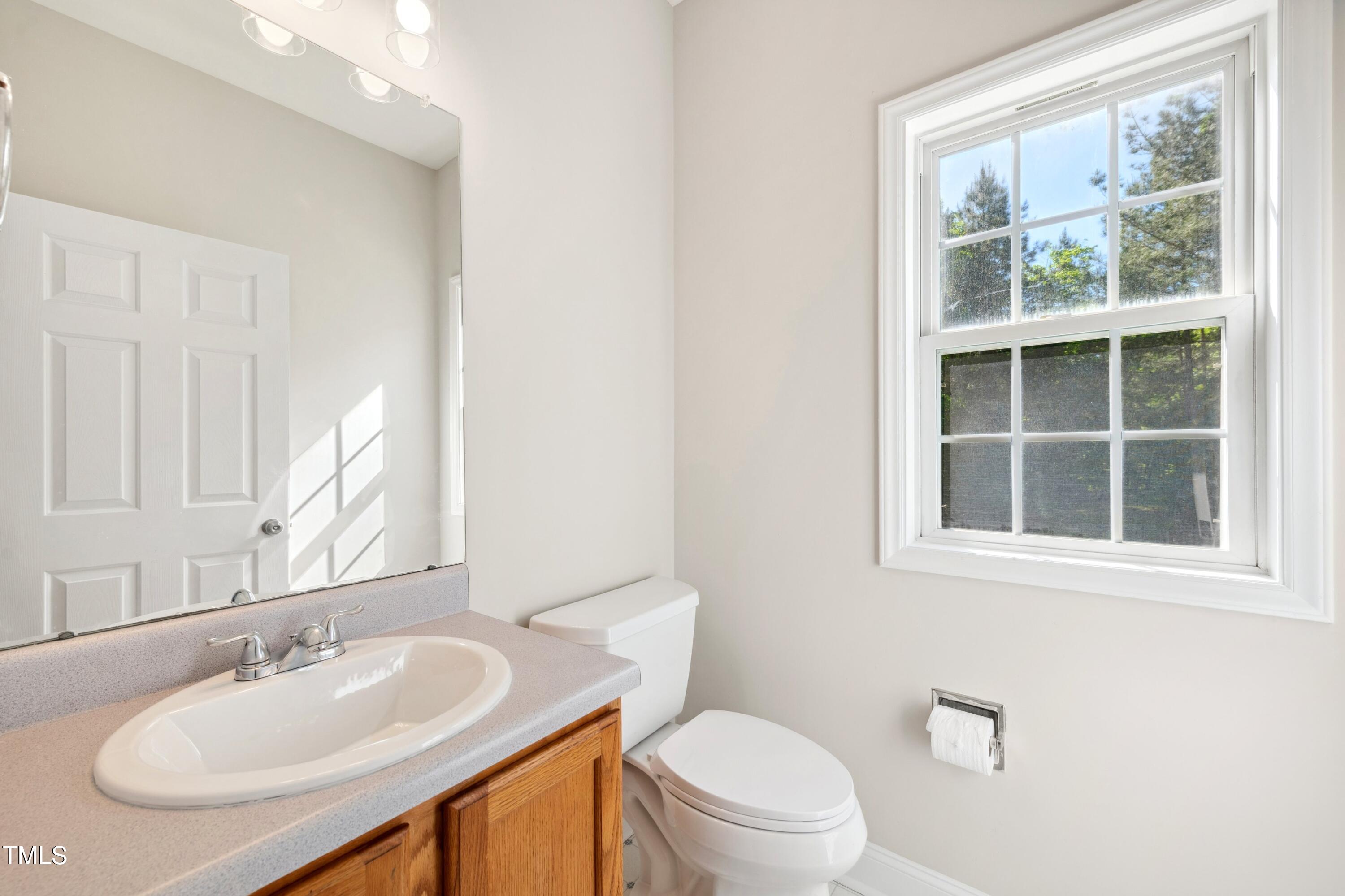 1909 Redding Lane Durham, NC 27712 - Photo 26 of 49 a bathroom with a sink and a toilet