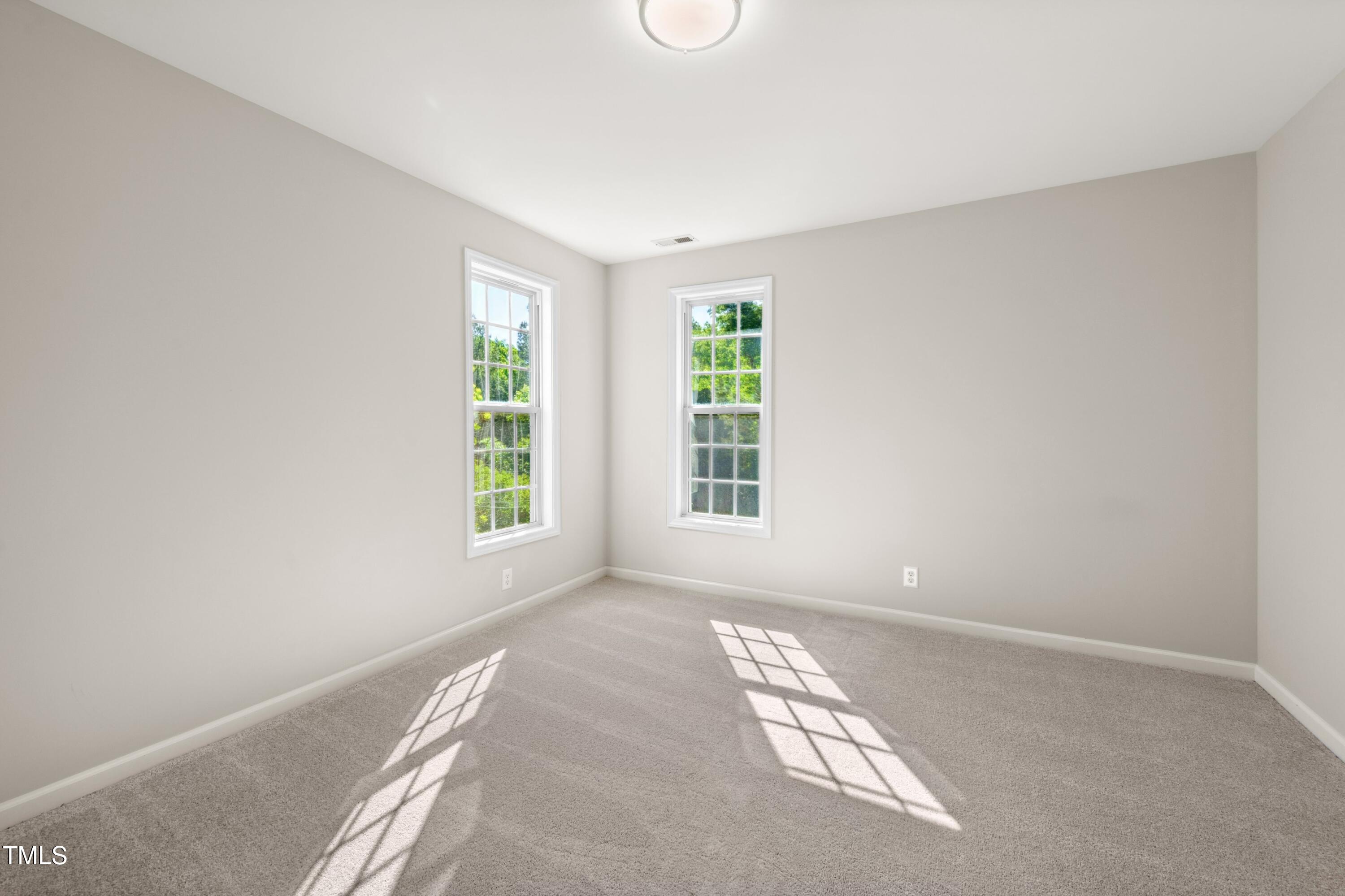 1909 Redding Lane Durham, NC 27712 - Photo 27 of 49 an empty room with windows