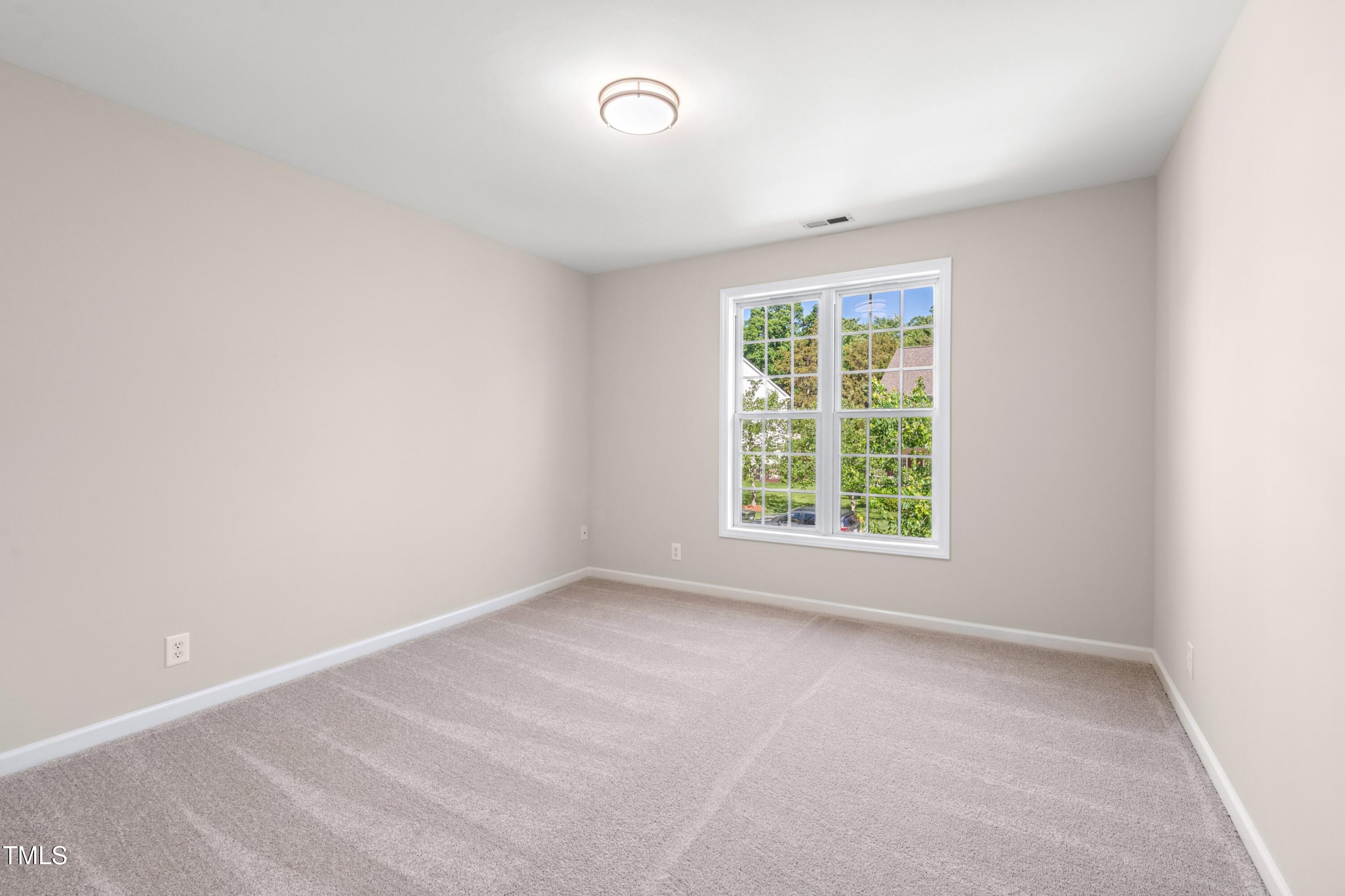 1909 Redding Lane Durham, NC 27712 - Photo 29 of 49 an empty room with a window