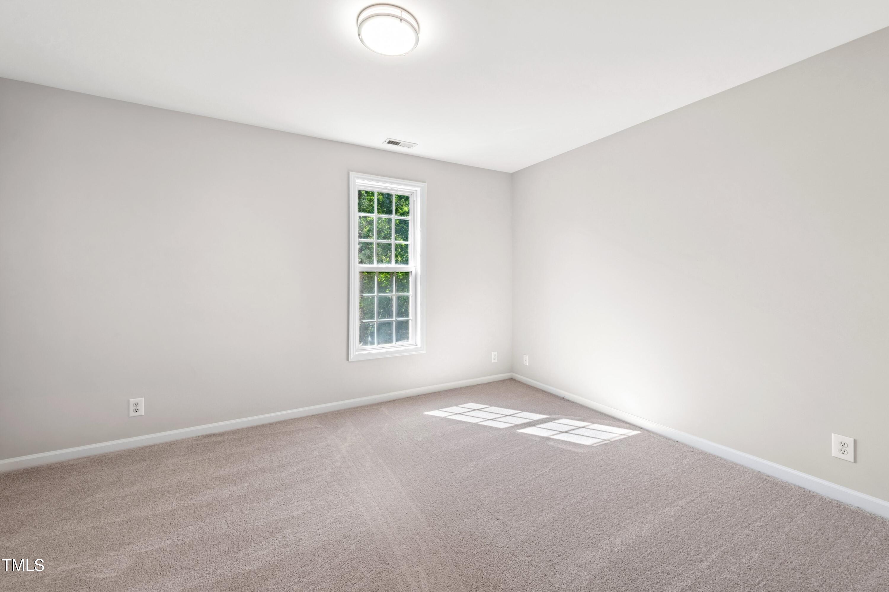 1909 Redding Lane Durham, NC 27712 - Photo 30 of 49 an empty room with windows