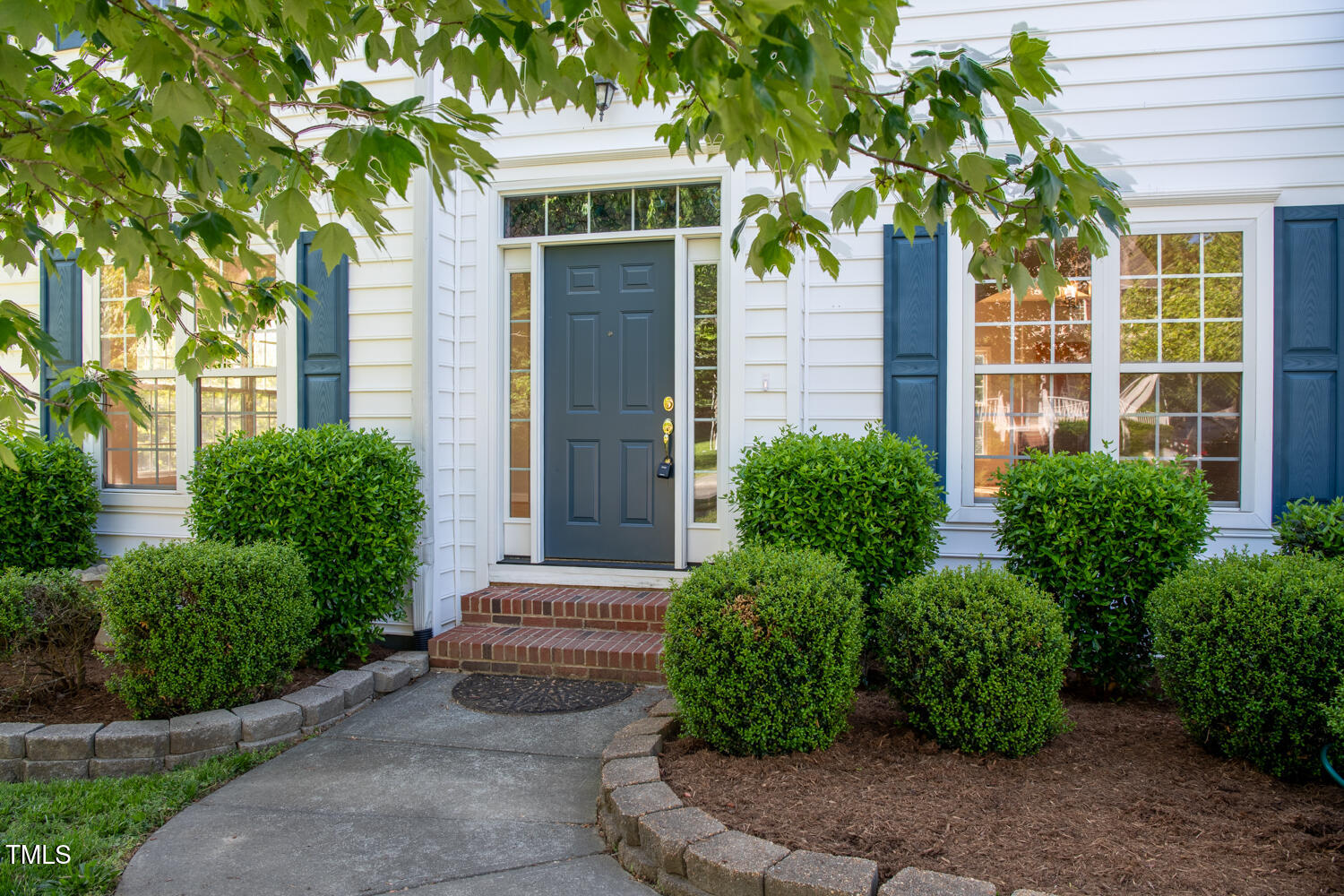 1909 Redding Lane Durham, NC 27712 - Photo 3 of 49 a front view of a house with garden