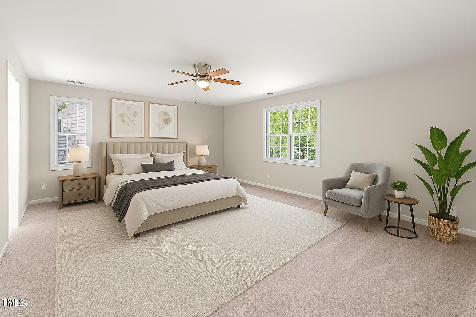 1909 Redding Lane Durham, NC 27712 - Photo 34 of 49 a bedroom with a large bed and windows