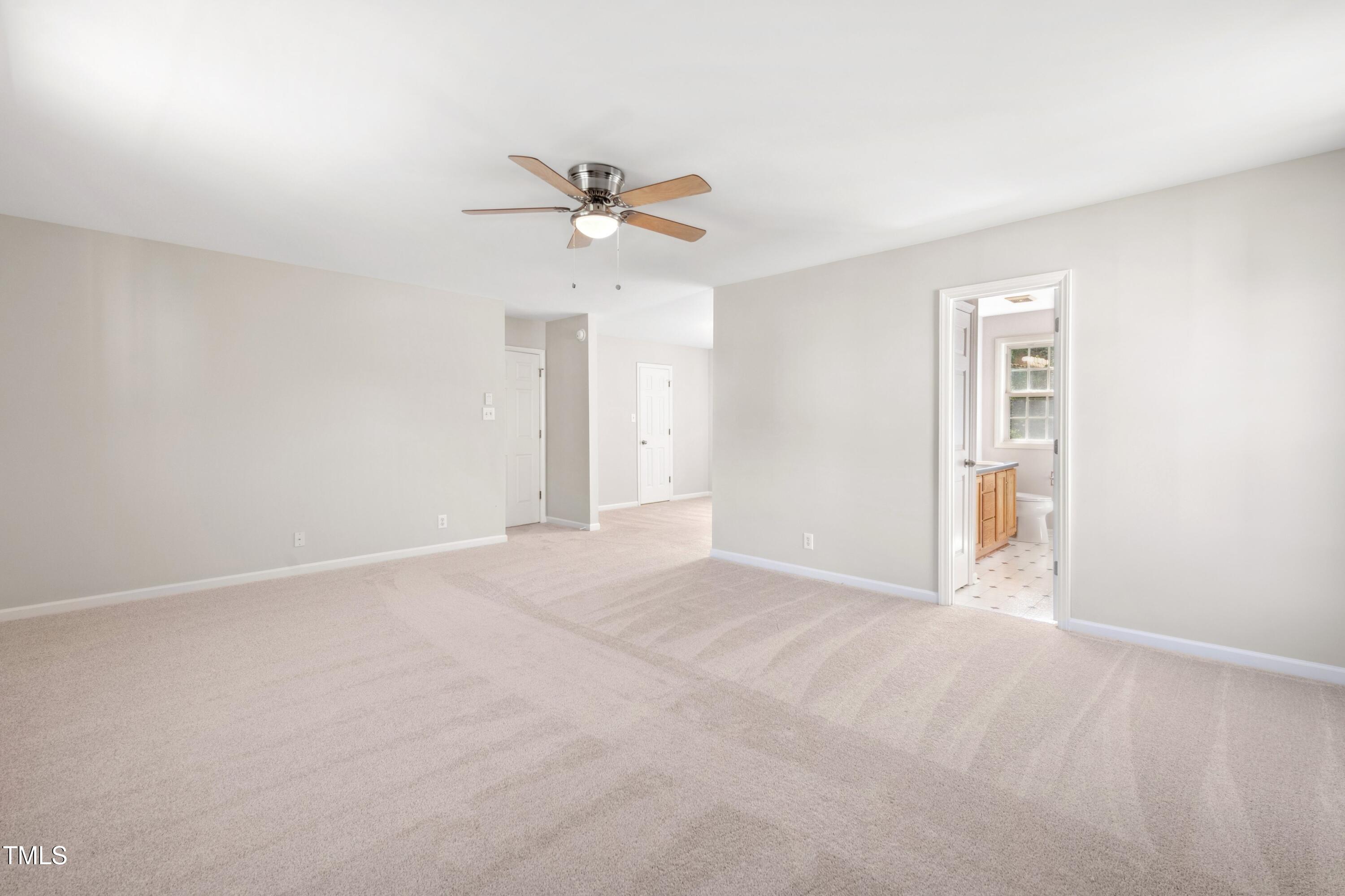 1909 Redding Lane Durham, NC 27712 - Photo 35 of 49 a view of an empty room with a window