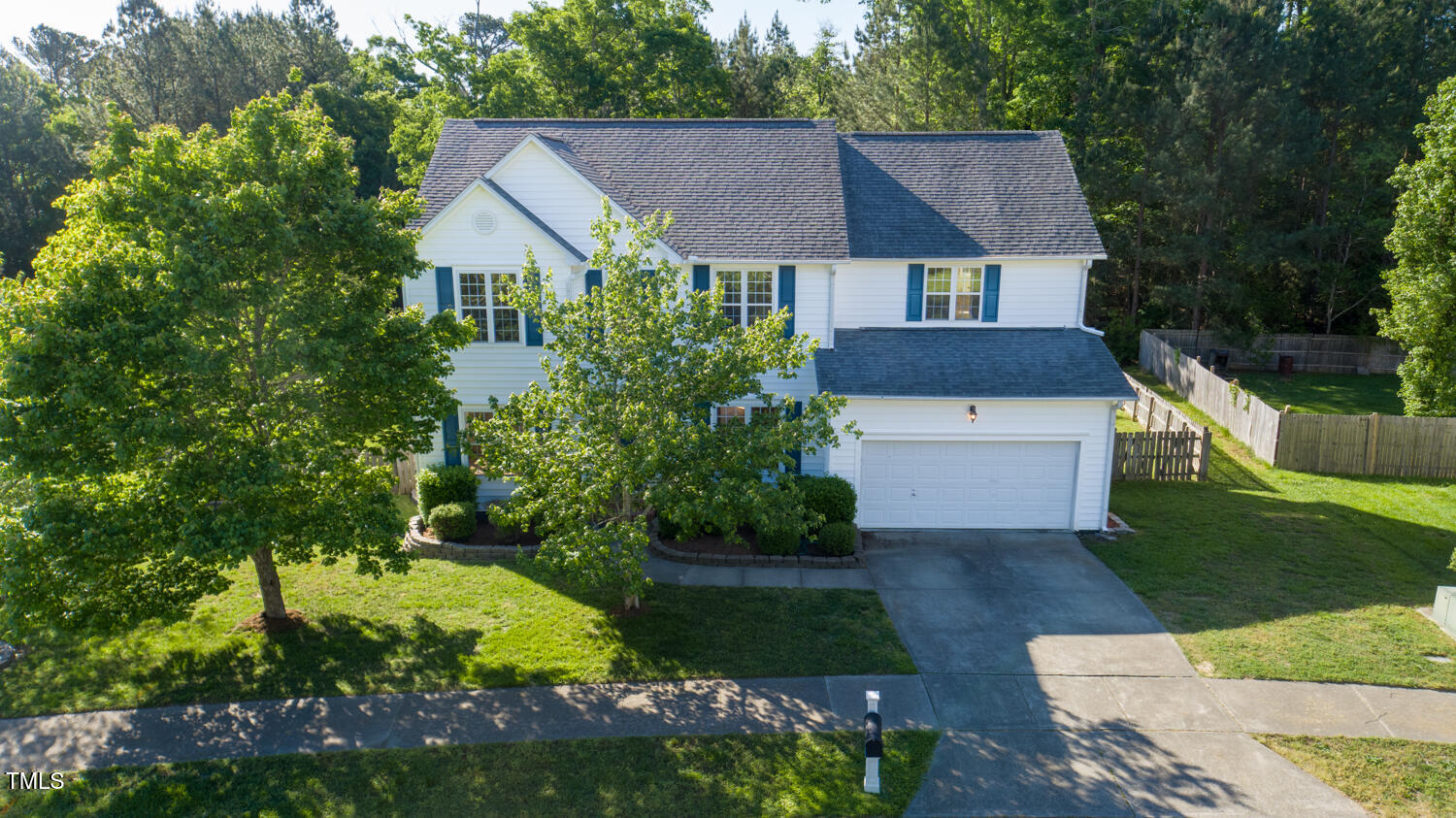 1909 Redding Lane Durham, NC 27712 - Photo 6 of 49 a front view of a house with a yard and garage