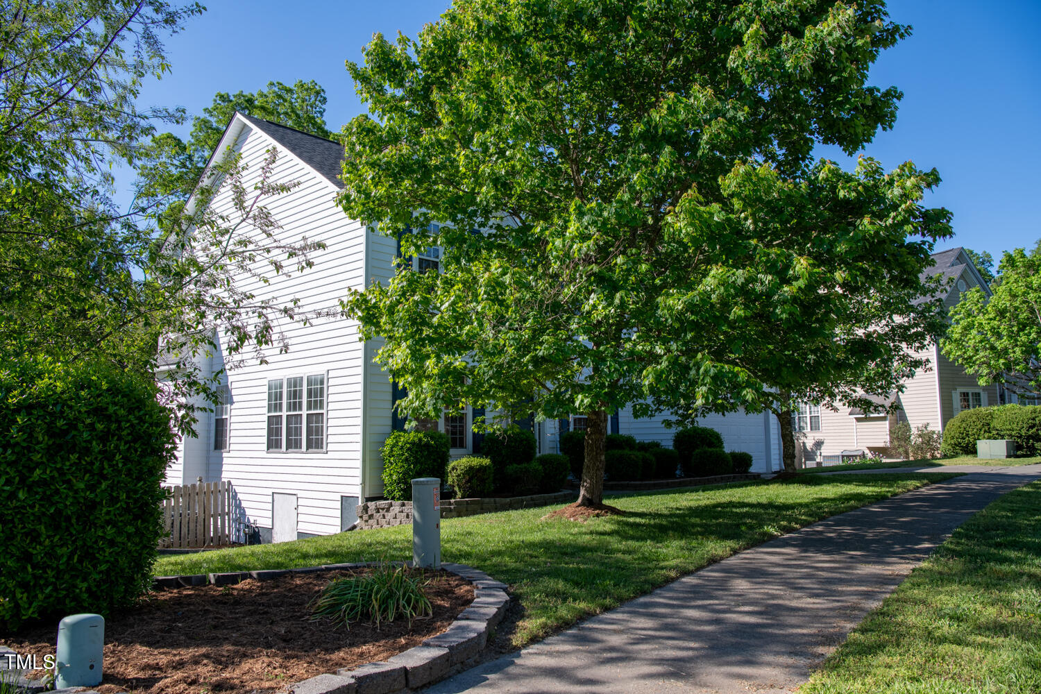 1909 Redding Lane Durham, NC 27712 - Photo 8 of 49 a front view of a house with a yard and a tree