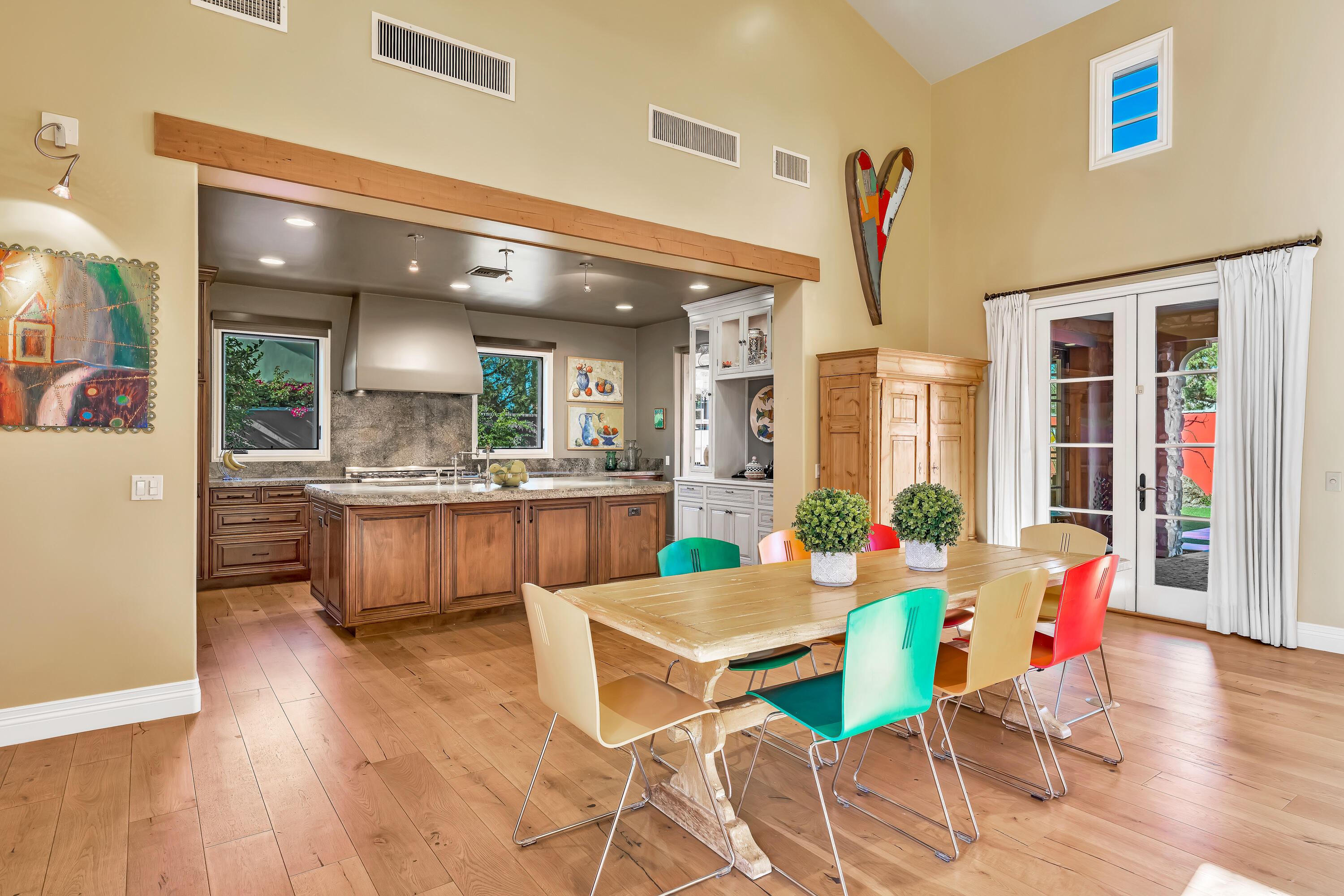 37 Cassis Circle Rancho Mirage, CA 92270 - Photo 15 of 56 a view of a dining room with furniture and wooden floor