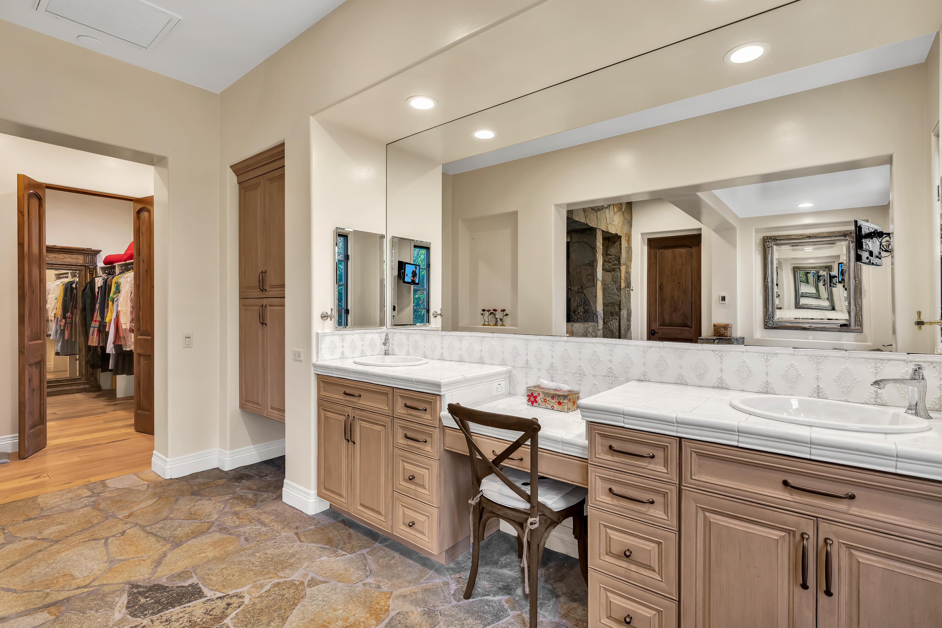 37 Cassis Circle Rancho Mirage, CA 92270 - Photo 27 of 56 a spacious bathroom with a granite countertop sink a mirror and a