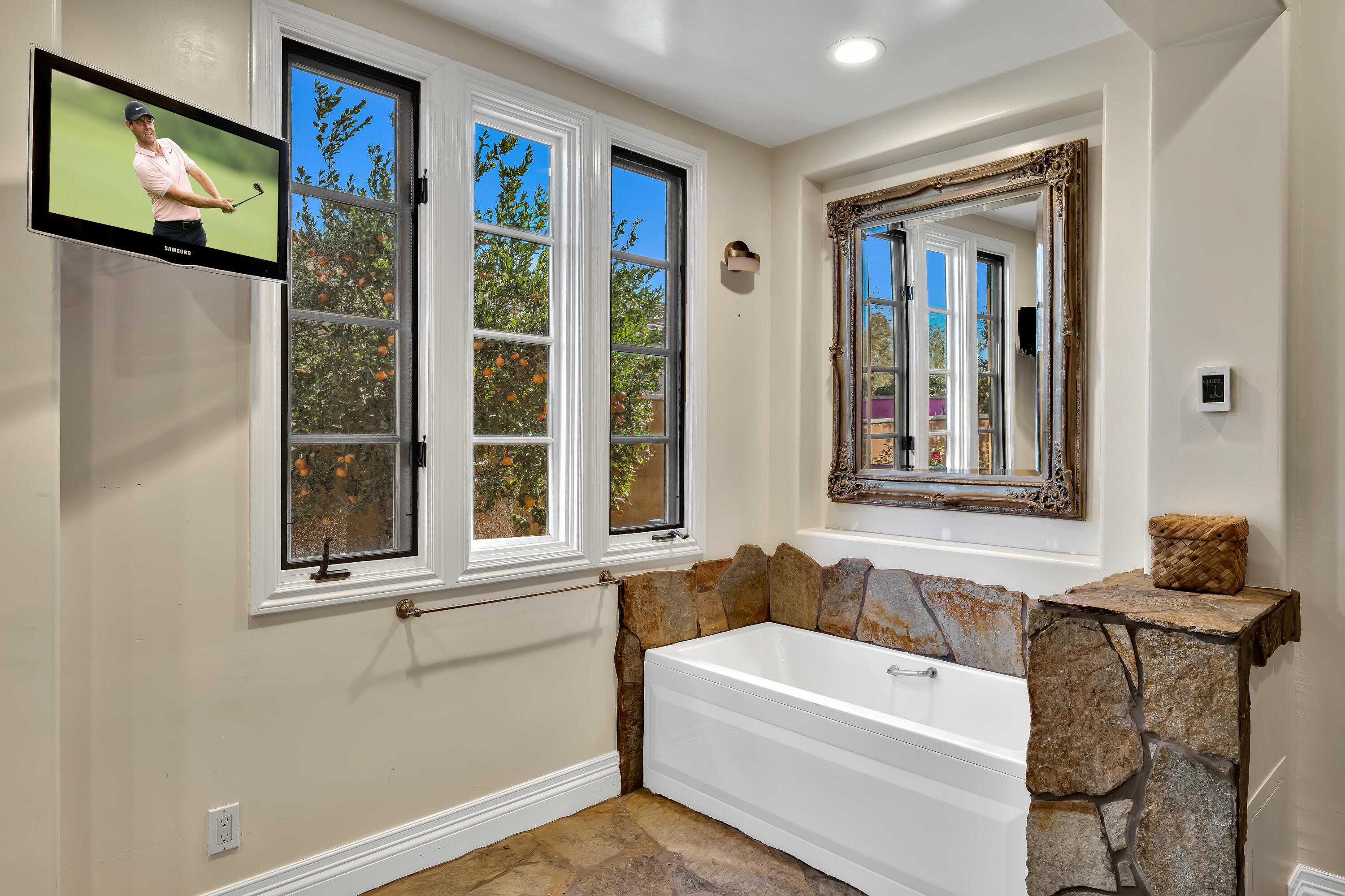 37 Cassis Circle Rancho Mirage, CA 92270 - Photo 28 of 56 a bathroom with a bathtub and a window
