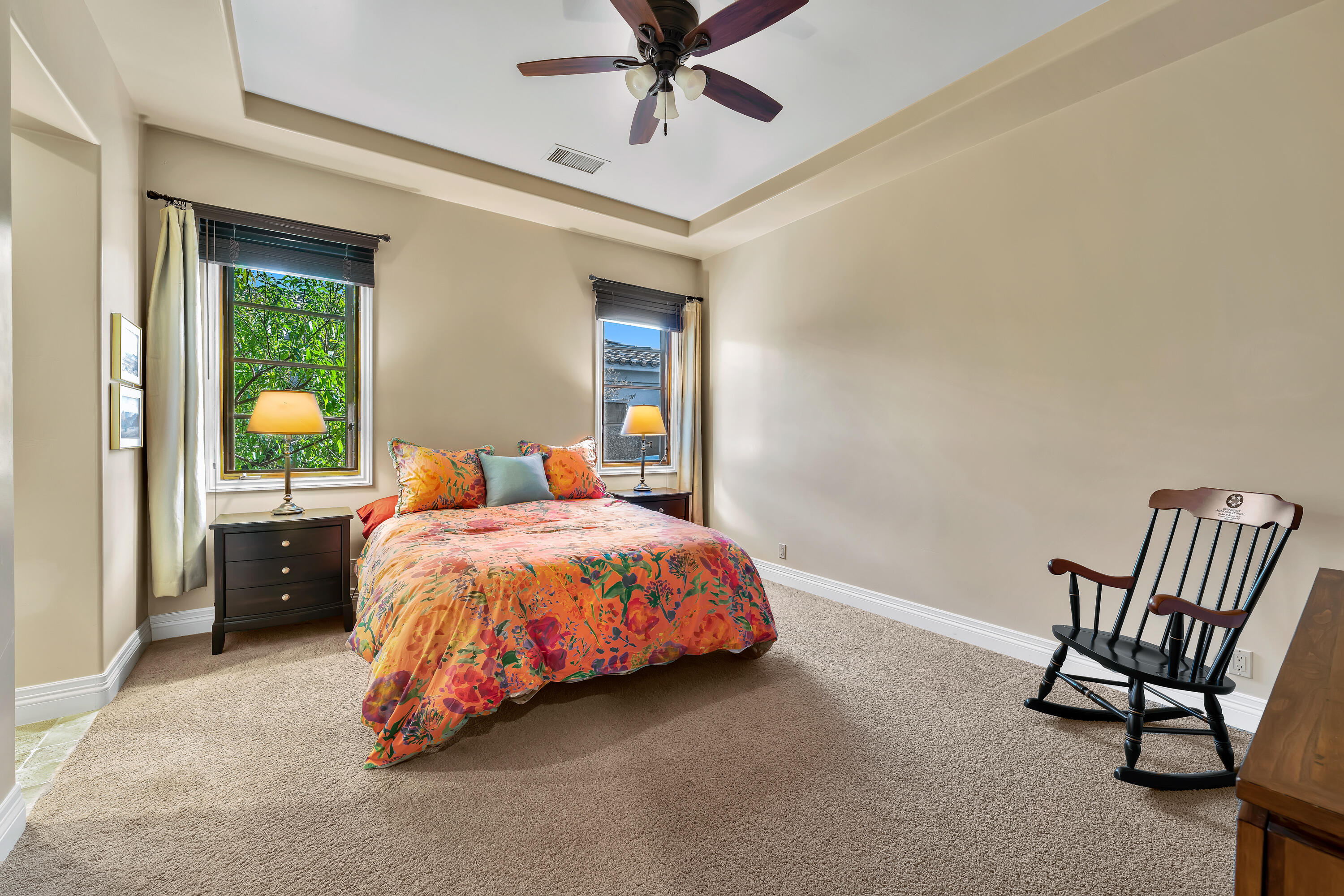 37 Cassis Circle Rancho Mirage, CA 92270 - Photo 30 of 56 a spacious bedroom with a bed and a chandelier
