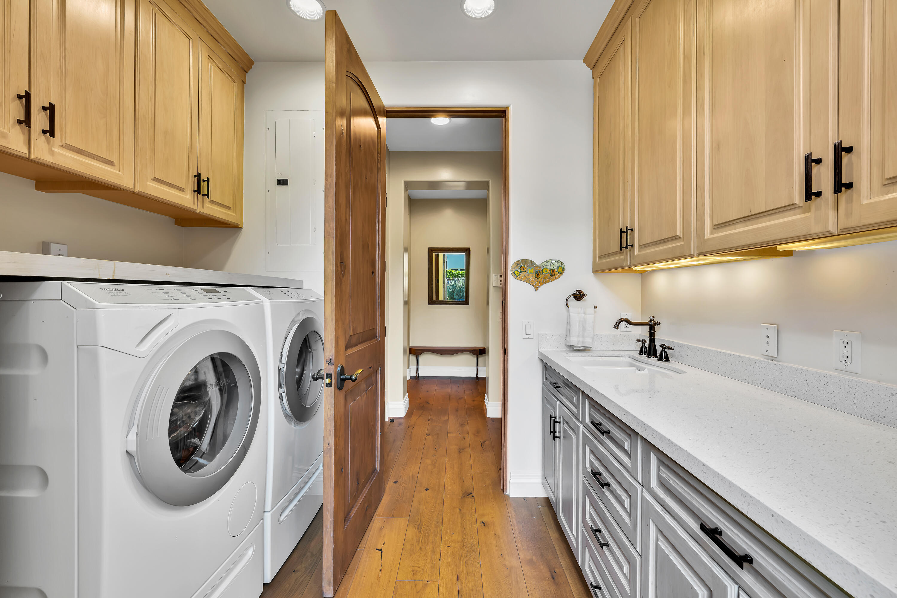 37 Cassis Circle Rancho Mirage, CA 92270 - Photo 35 of 56 a view of a kitchen with sink and washing machine