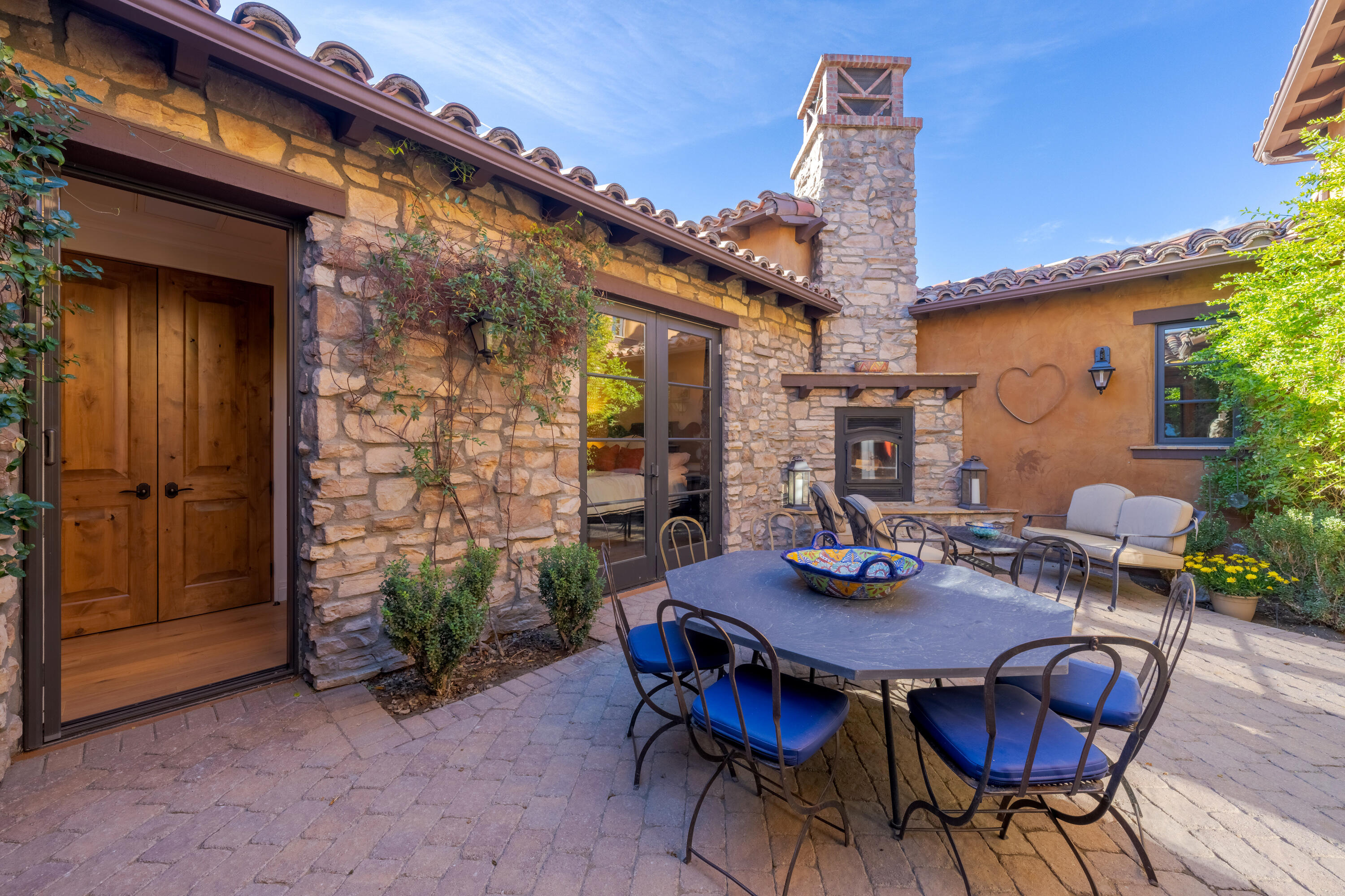 37 Cassis Circle Rancho Mirage, CA 92270 - Photo 36 of 56 a view of a dining table and chairs in the patio