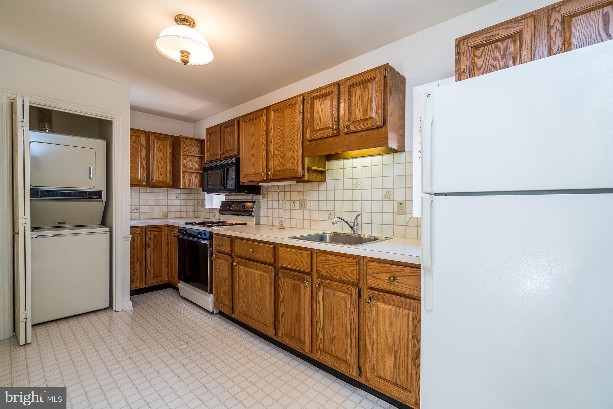 15 Amberly Way Lititz, PA 17543 - Photo 11 of 24 a kitchen with a refrigerator sink and cabinets