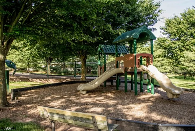 a view of a wooden deck and a lake view