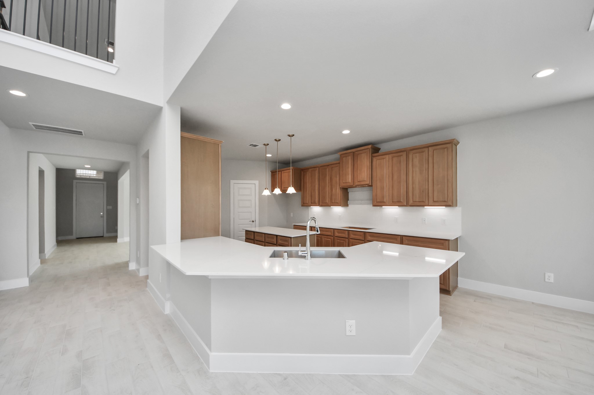 3109 North Spring Drive Spring, TX 77373 - Photo 13 of 50 The kitchen is a culinary haven, featuring granite countertops, a tile backsplash, stainless steel appliances, 42” upper cabinets, and undercabinet lighting.
