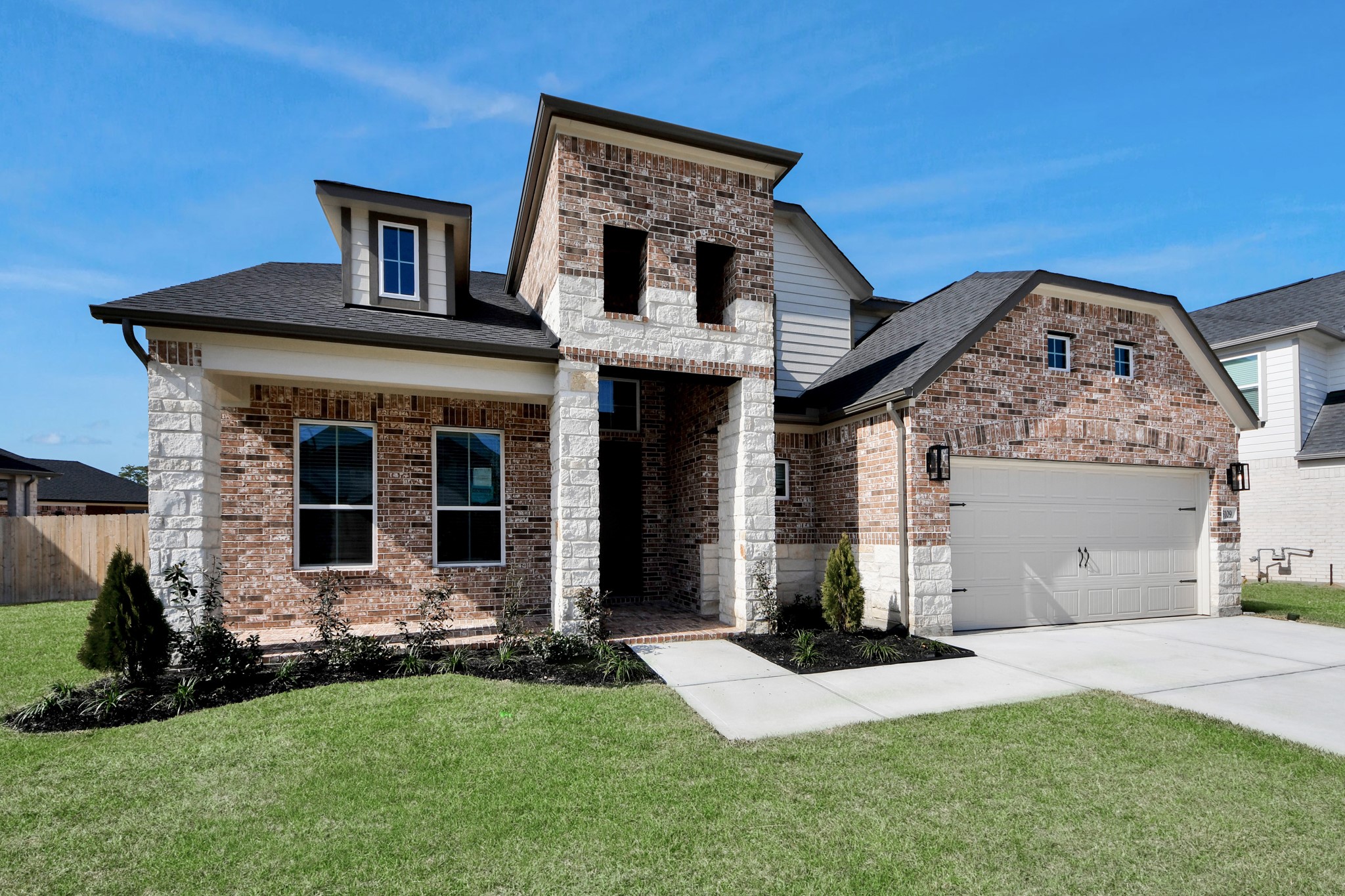 3109 North Spring Drive Spring, TX 77373 - Photo 2 of 50 Home features a convenient 2-car garage complemented by a spacious driveway, offering ample parking for you and your guests.