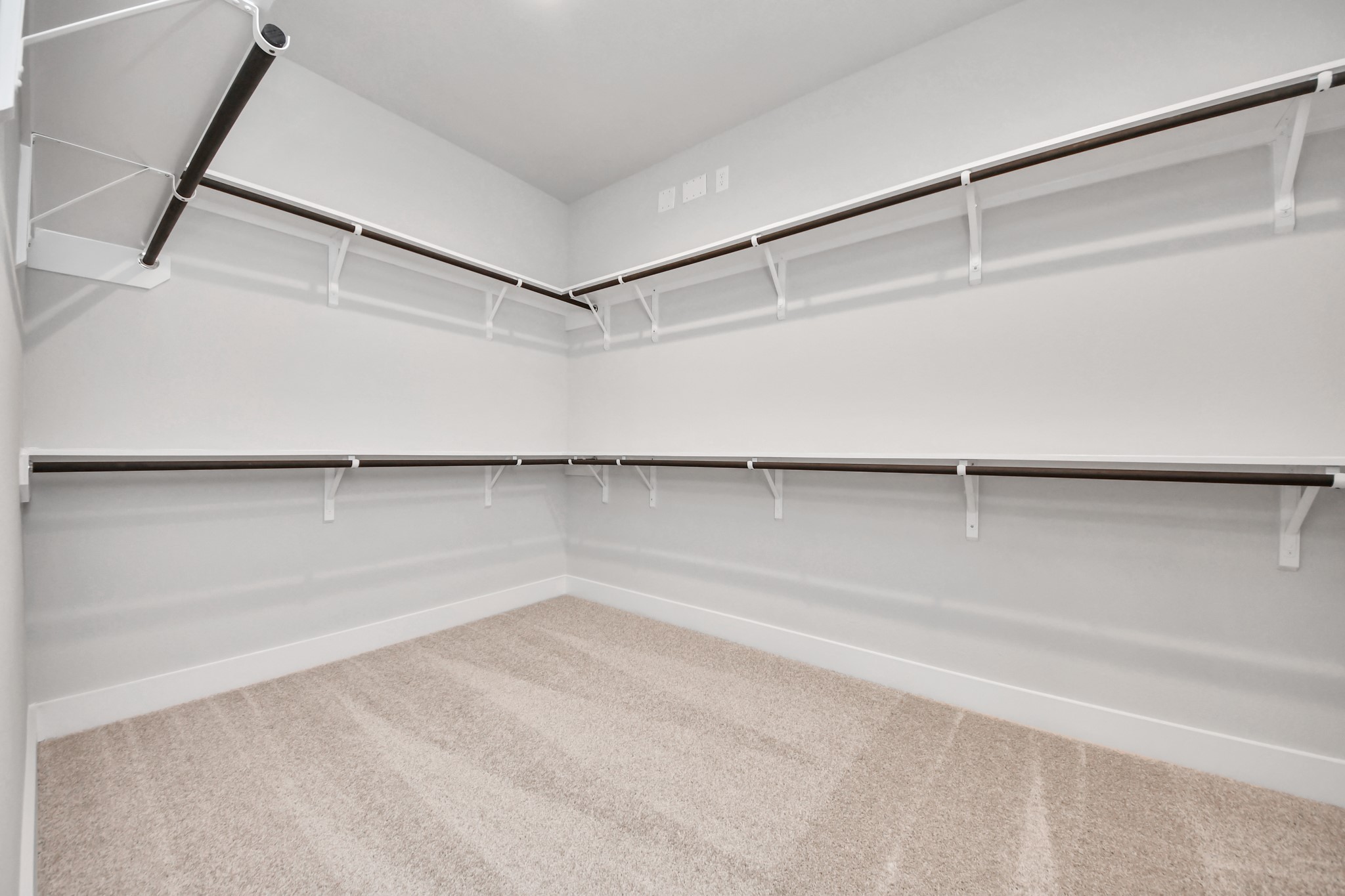 3109 North Spring Drive Spring, TX 77373 - Photo 29 of 50 Walk-in closet that epitomizes luxury and practicality. This generously sized space features built-in shelving, offering abundant room for impeccable organization. High ceilings and recessed lighting create a bright and welcoming ambiance.