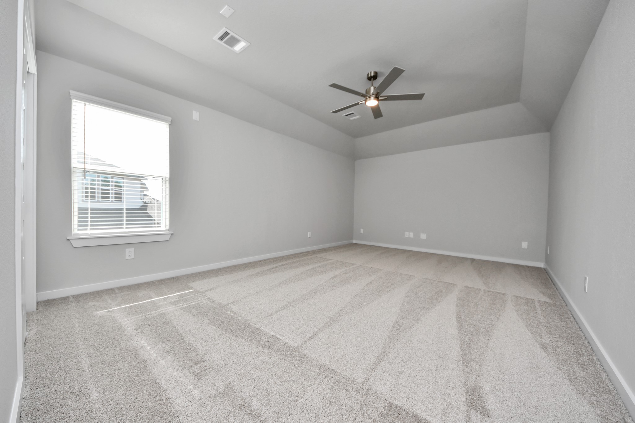 3109 North Spring Drive Spring, TX 77373 - Photo 34 of 50 Secondary bedroom features plush carpeting, large windows that let in plenty of natural light, bright paint, and spacious closets.