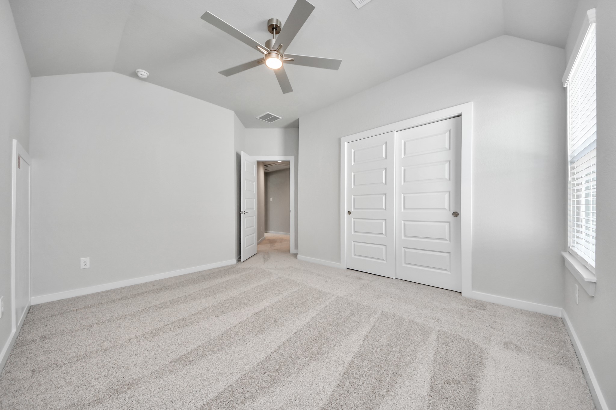 3109 North Spring Drive Spring, TX 77373 - Photo 36 of 50 Generously sized secondary bedrooms featuring spacious closets, soft and inviting carpeting underfoot, large windows allowing plenty of natural light, and the added touch of privacy blinds for your personal retreat.