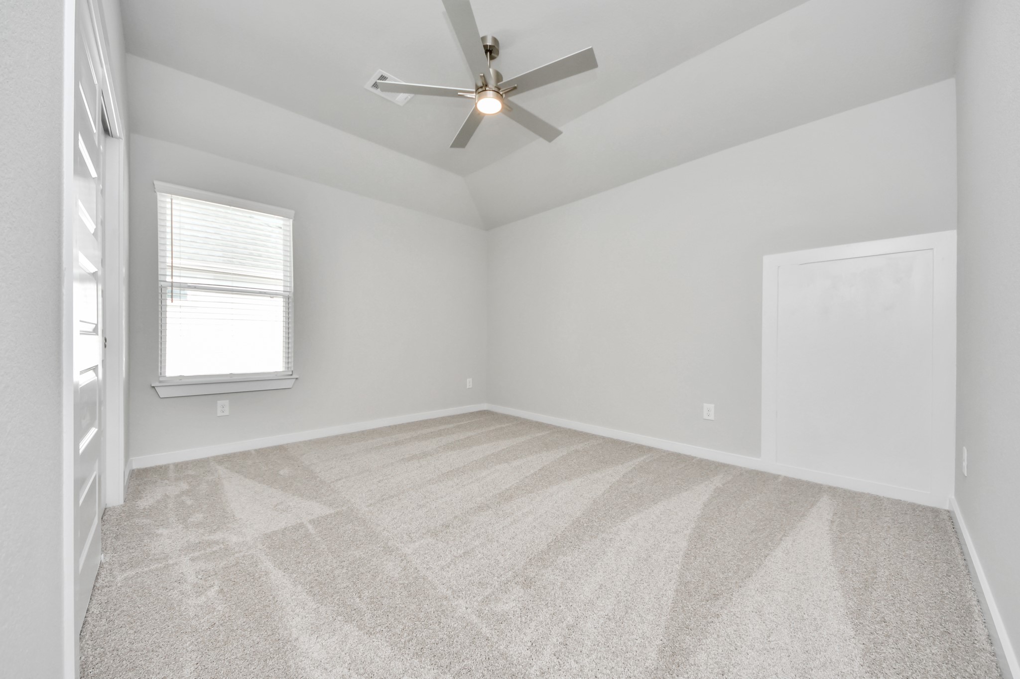 3109 North Spring Drive Spring, TX 77373 - Photo 38 of 50 Secondary bedroom features plush carpeting, large windows that let in plenty of natural light, bright paint, and spacious closets.