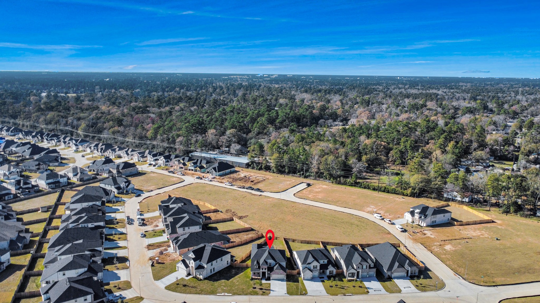 3109 North Spring Drive Spring, TX 77373 - Photo 4 of 50 An aerial view of a spacious subdivision lot, highlighting a well-maintained yard and a fully fenced perimeter, offering both privacy and expansive outdoor space.